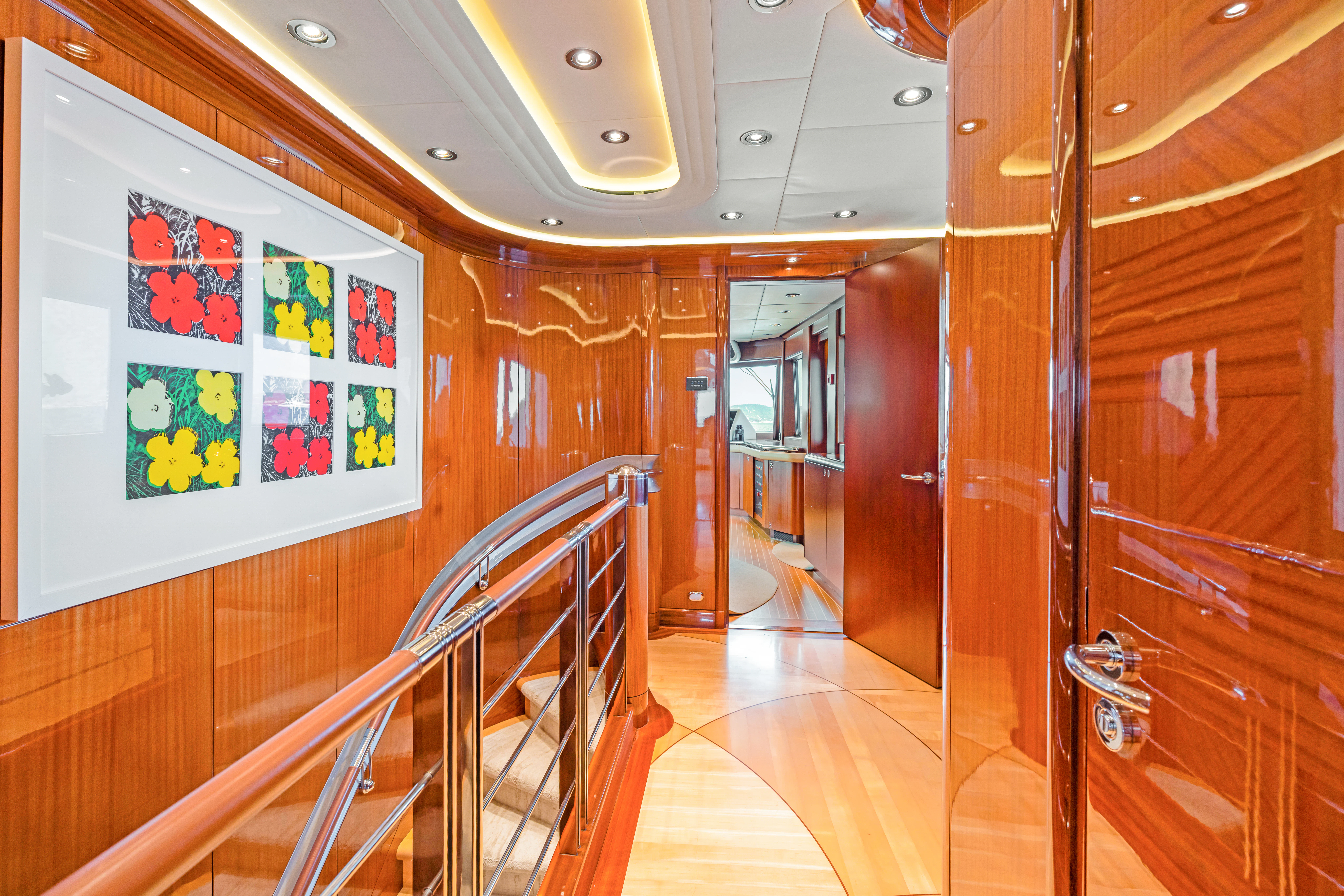 a hallway with wood doors aboard AMICA MEA Yacht for Sale