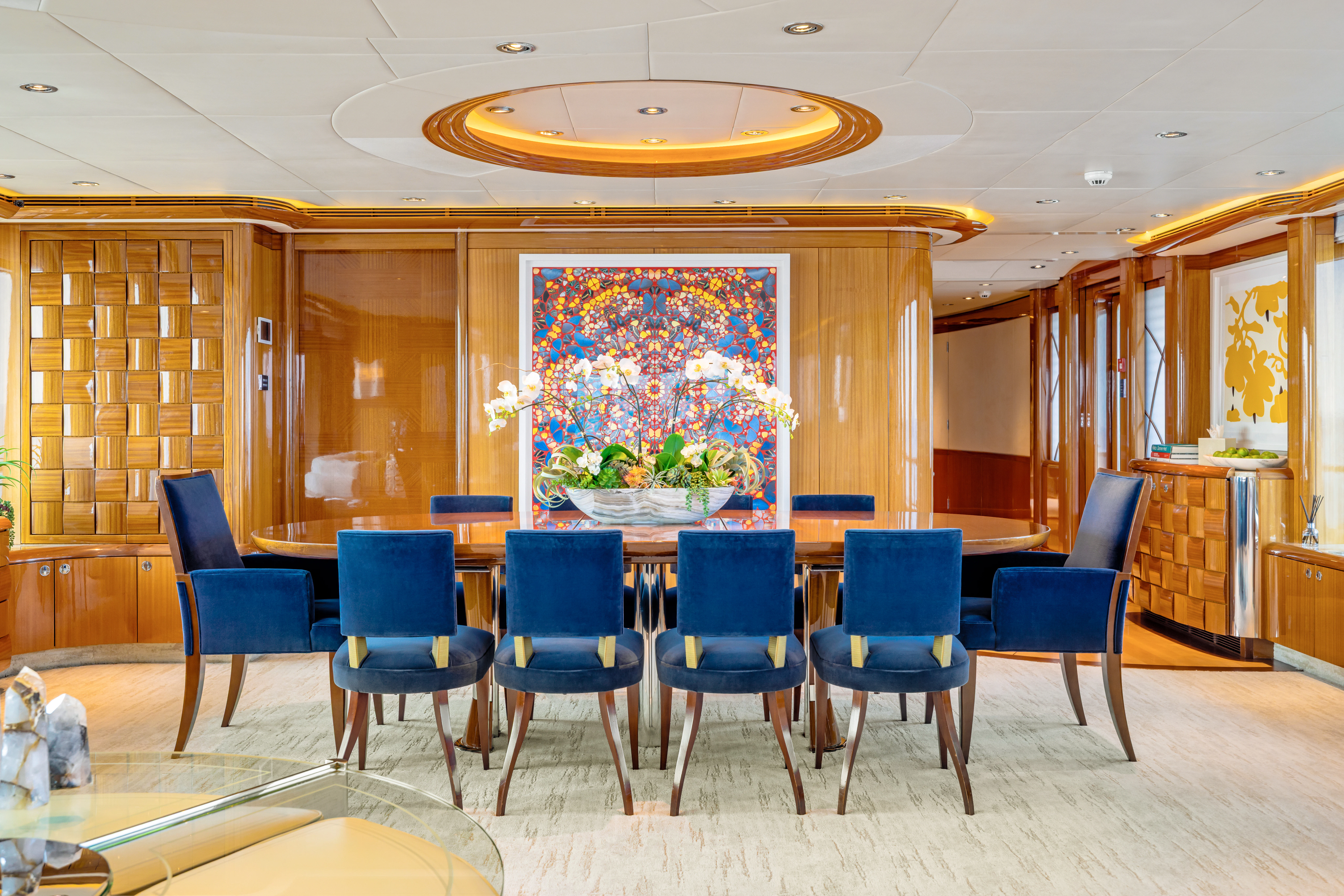 a room with a table and chairs aboard AMICA MEA Yacht for Sale