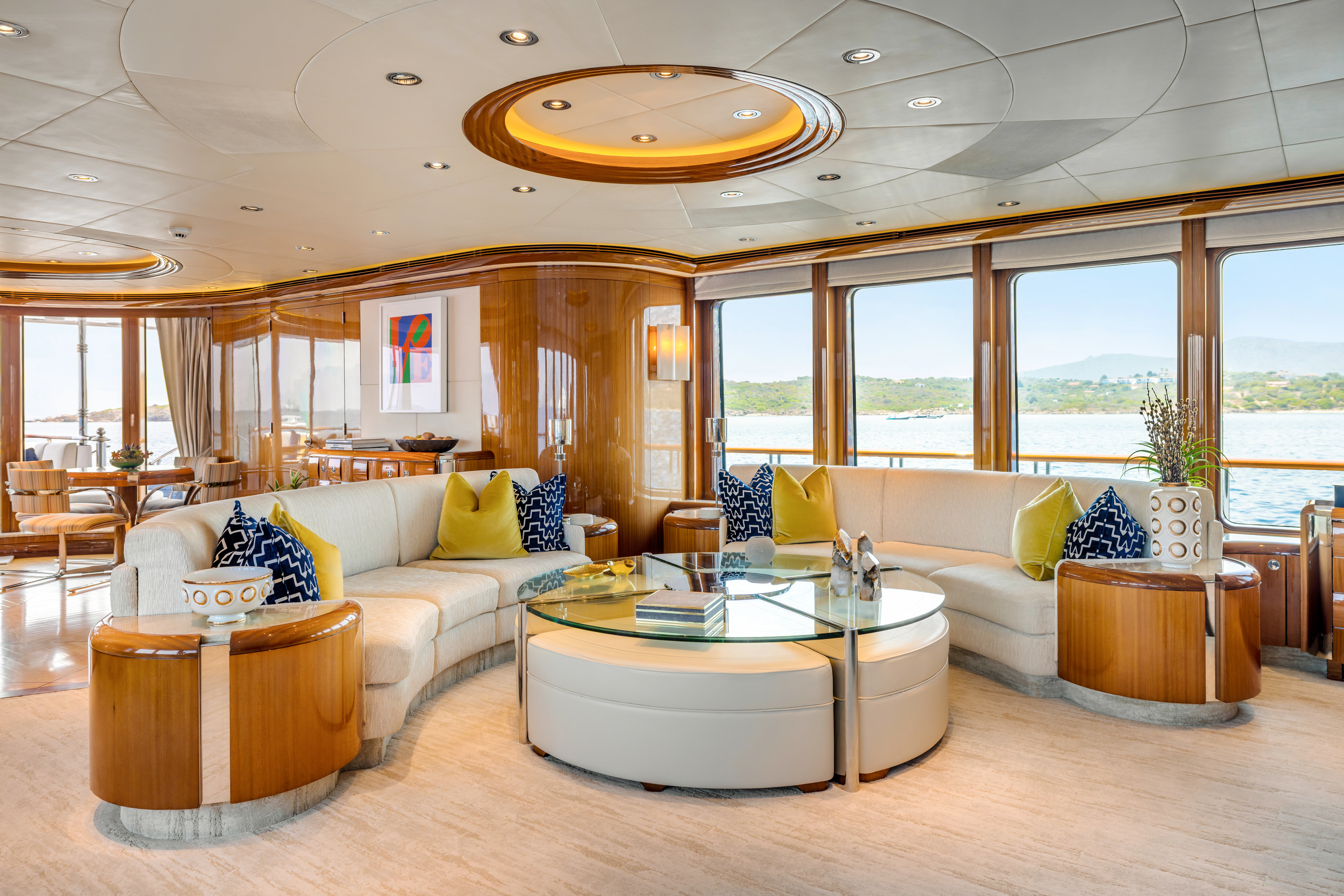 a living room with a large window aboard AMICA MEA Yacht for Sale