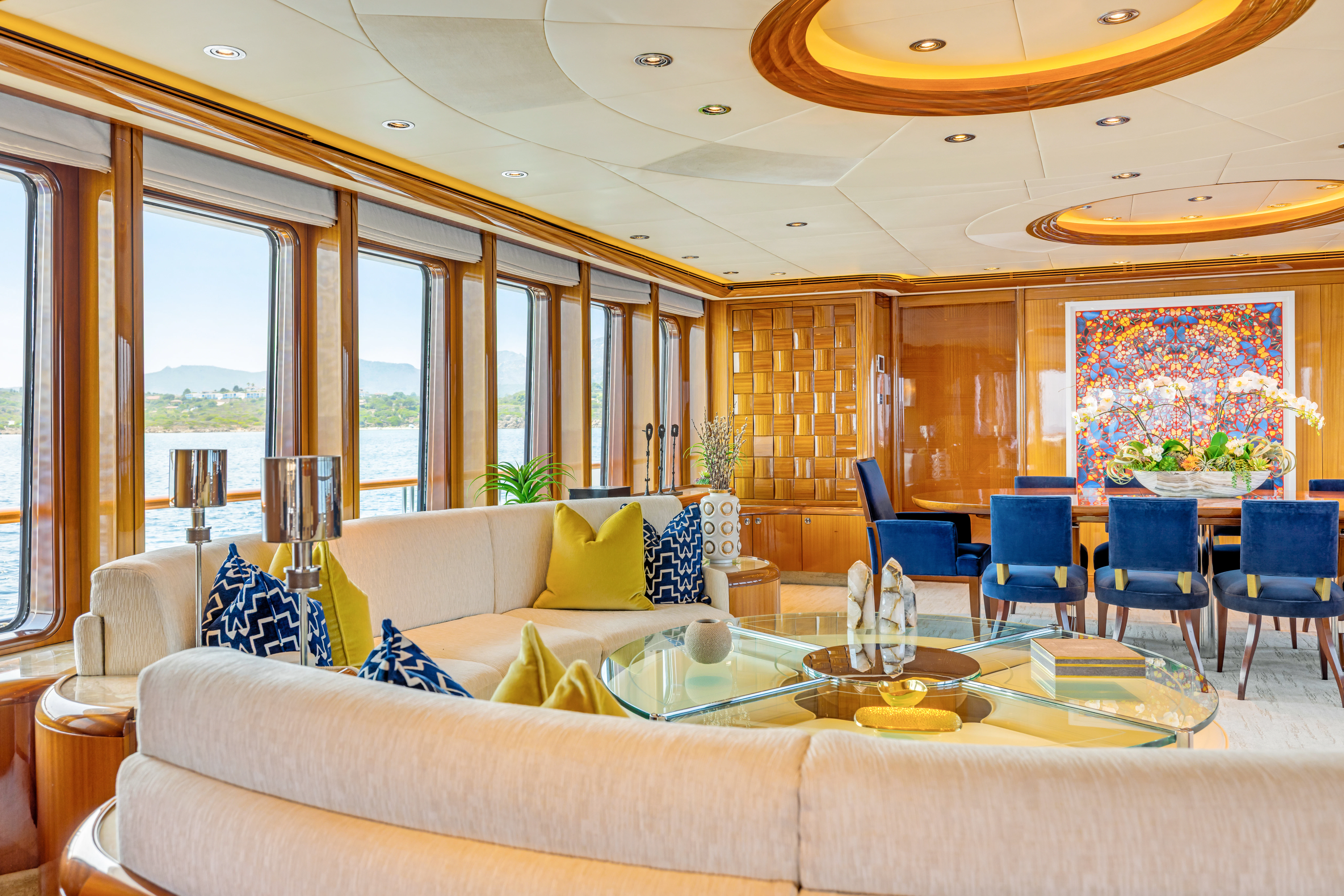 a living room with a couch and a table aboard AMICA MEA Yacht for Sale