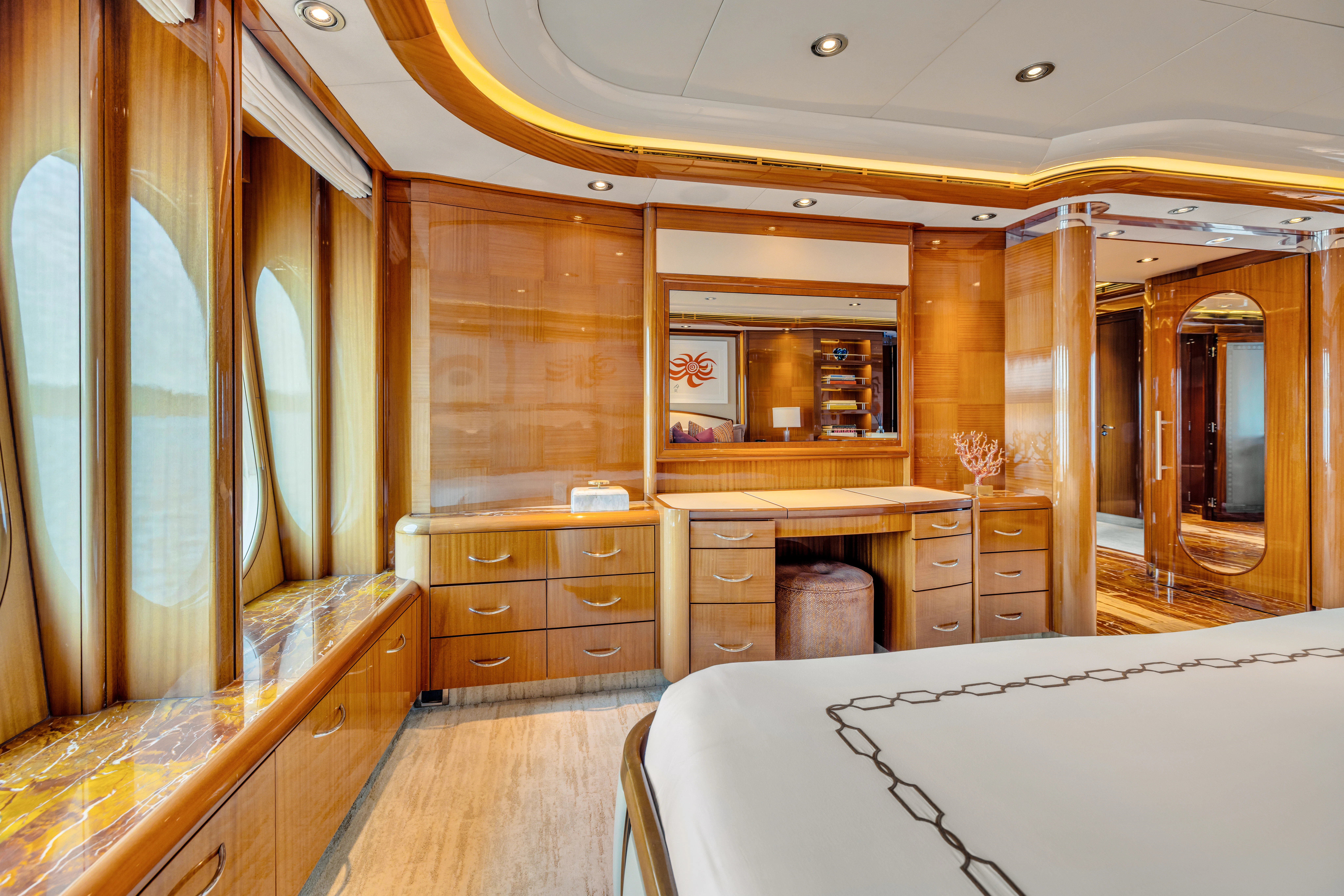 a room with a bed and a dresser aboard AMICA MEA Yacht for Sale