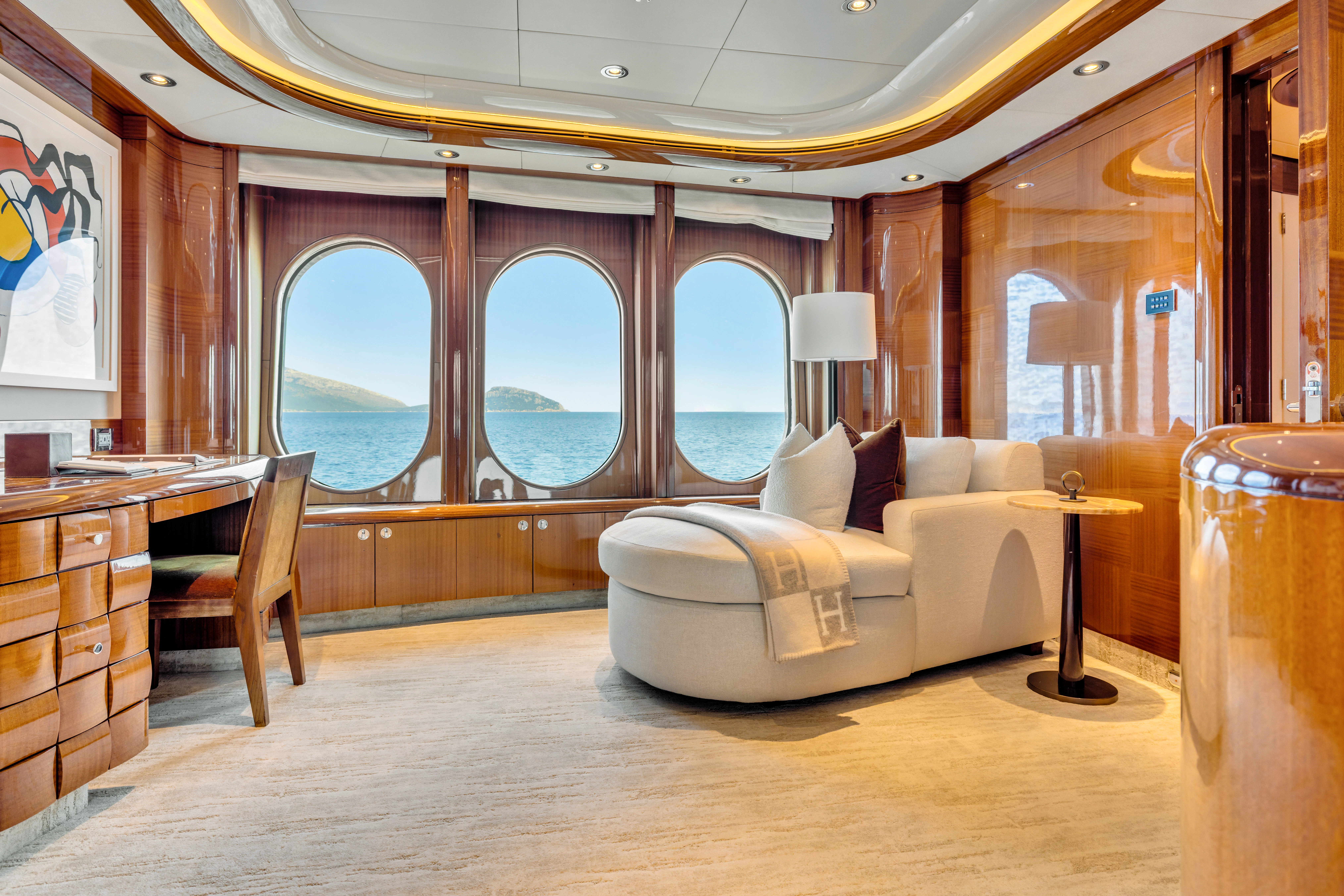 a room with a couch and a table aboard AMICA MEA Yacht for Sale