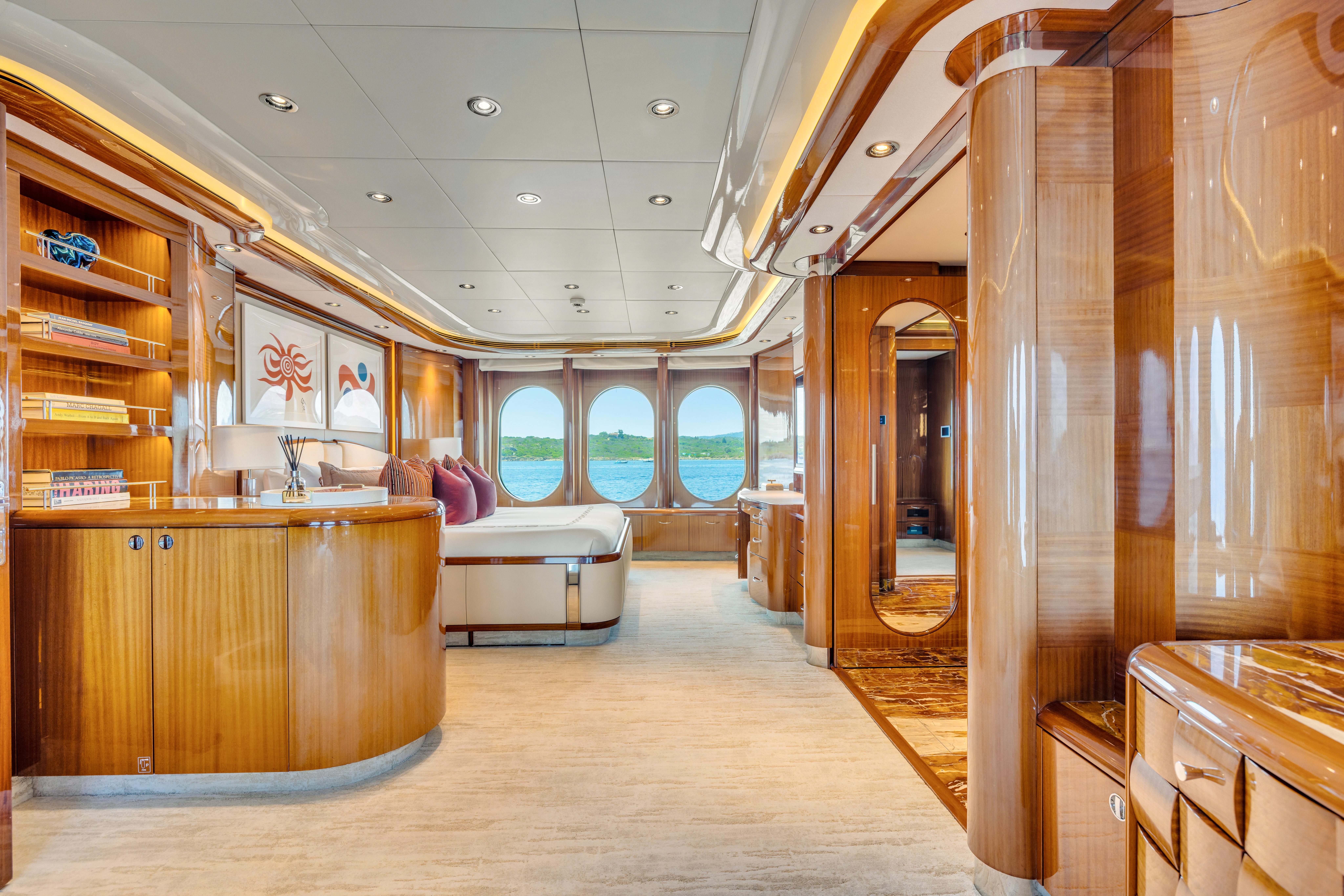 a room with wooden furniture aboard AMICA MEA Yacht for Sale