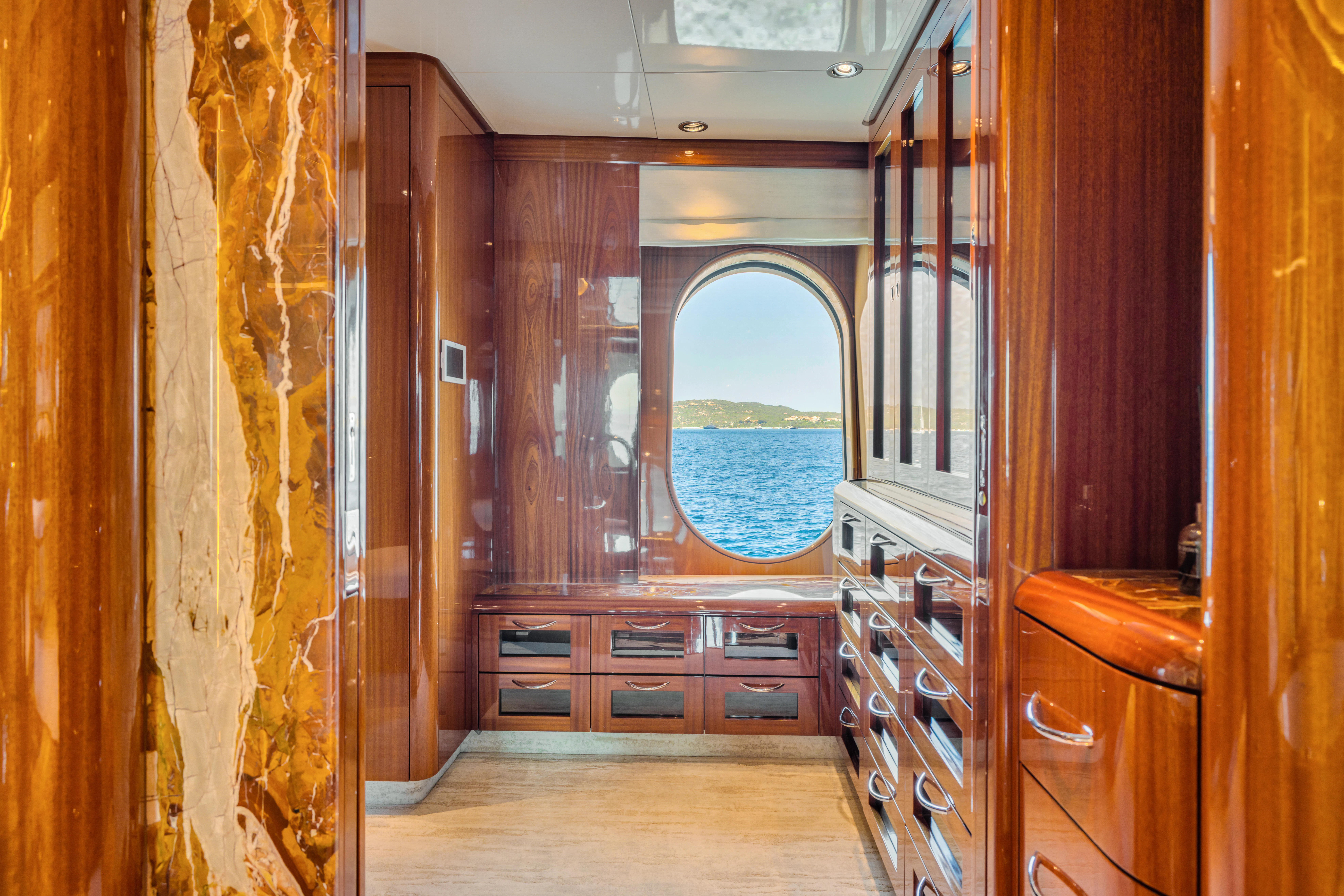 a room with wooden cabinets aboard AMICA MEA Yacht for Sale