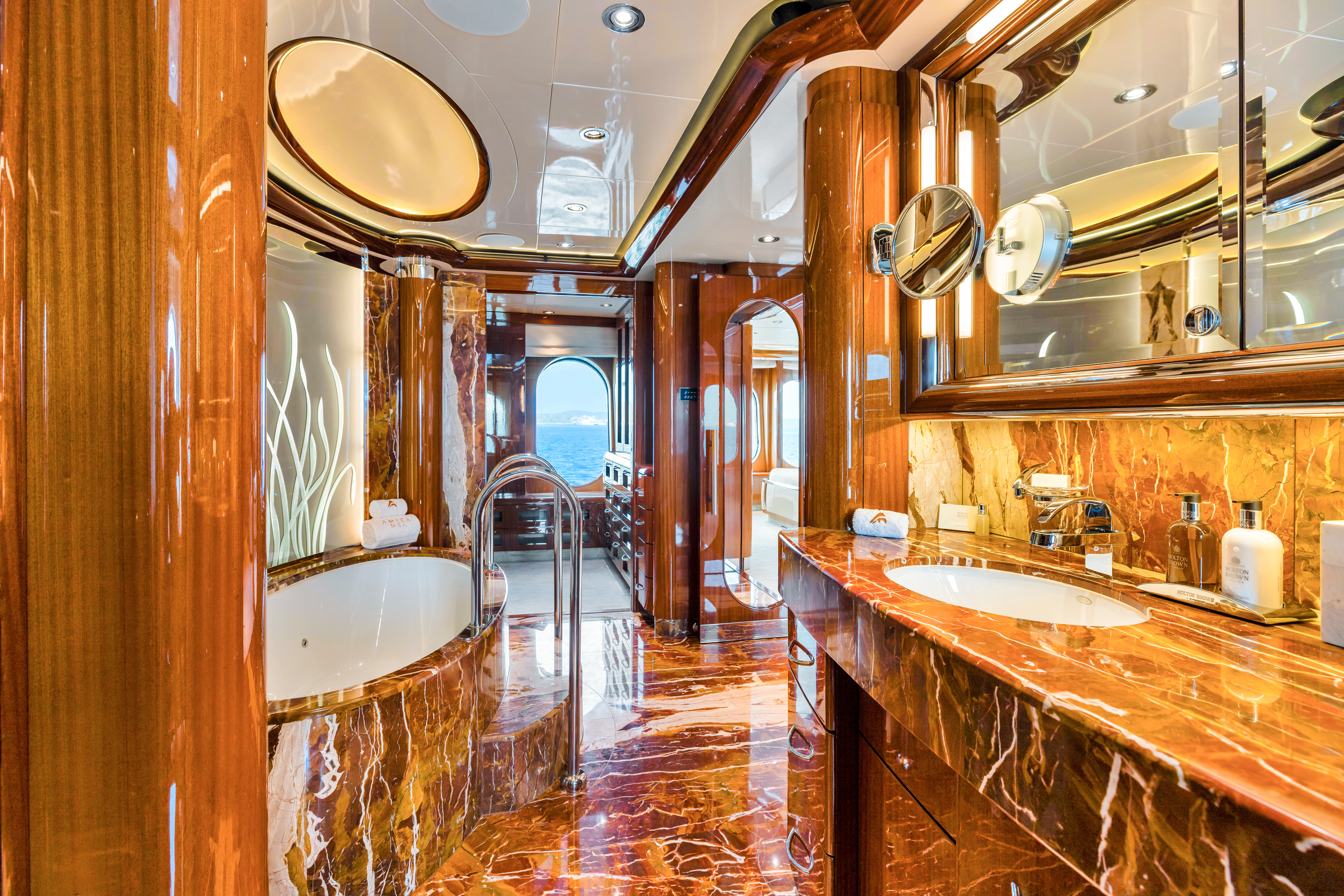 a bathroom with a large mirror aboard AMICA MEA Yacht for Sale