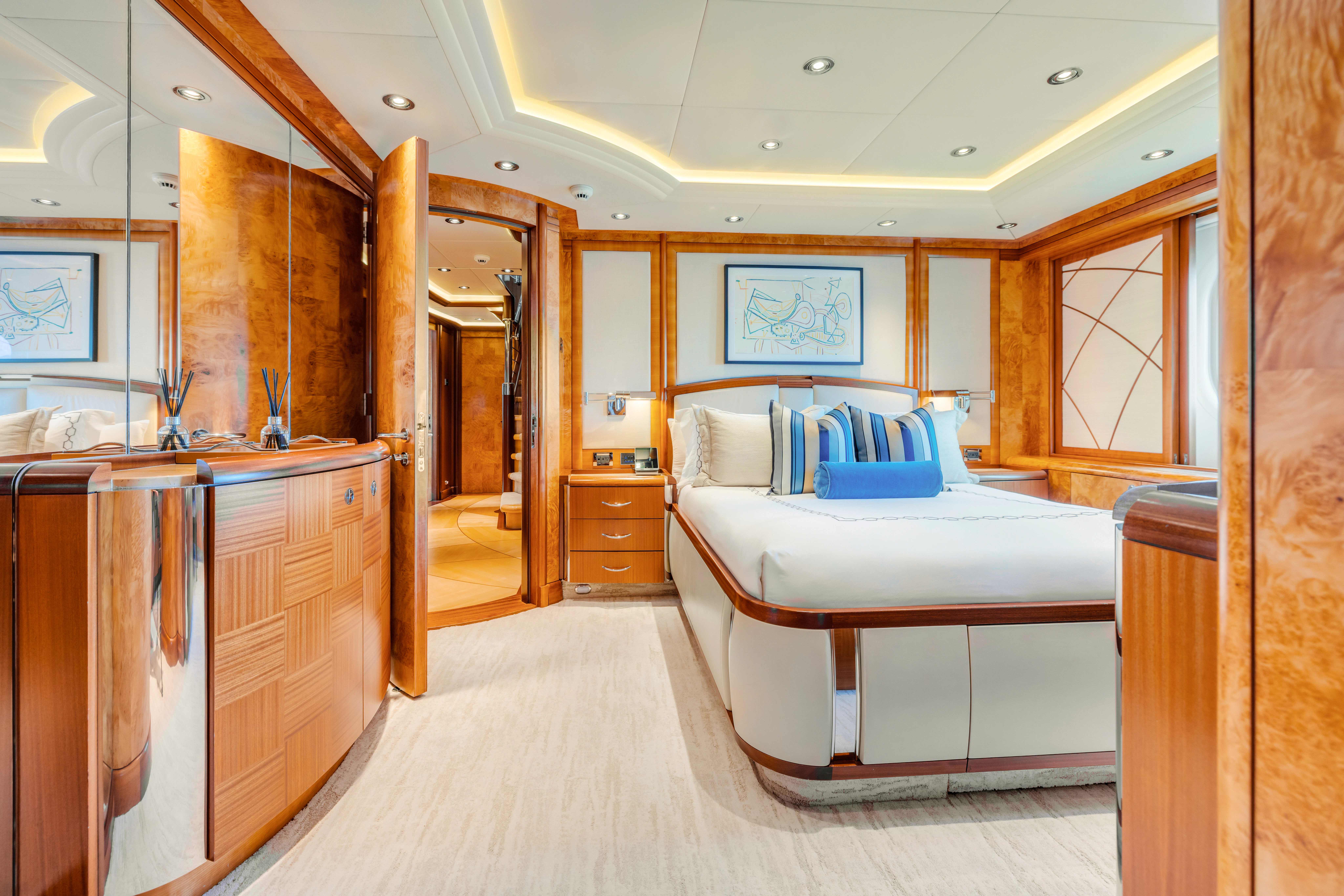 a bedroom with a bed and a desk aboard AMICA MEA Yacht for Sale