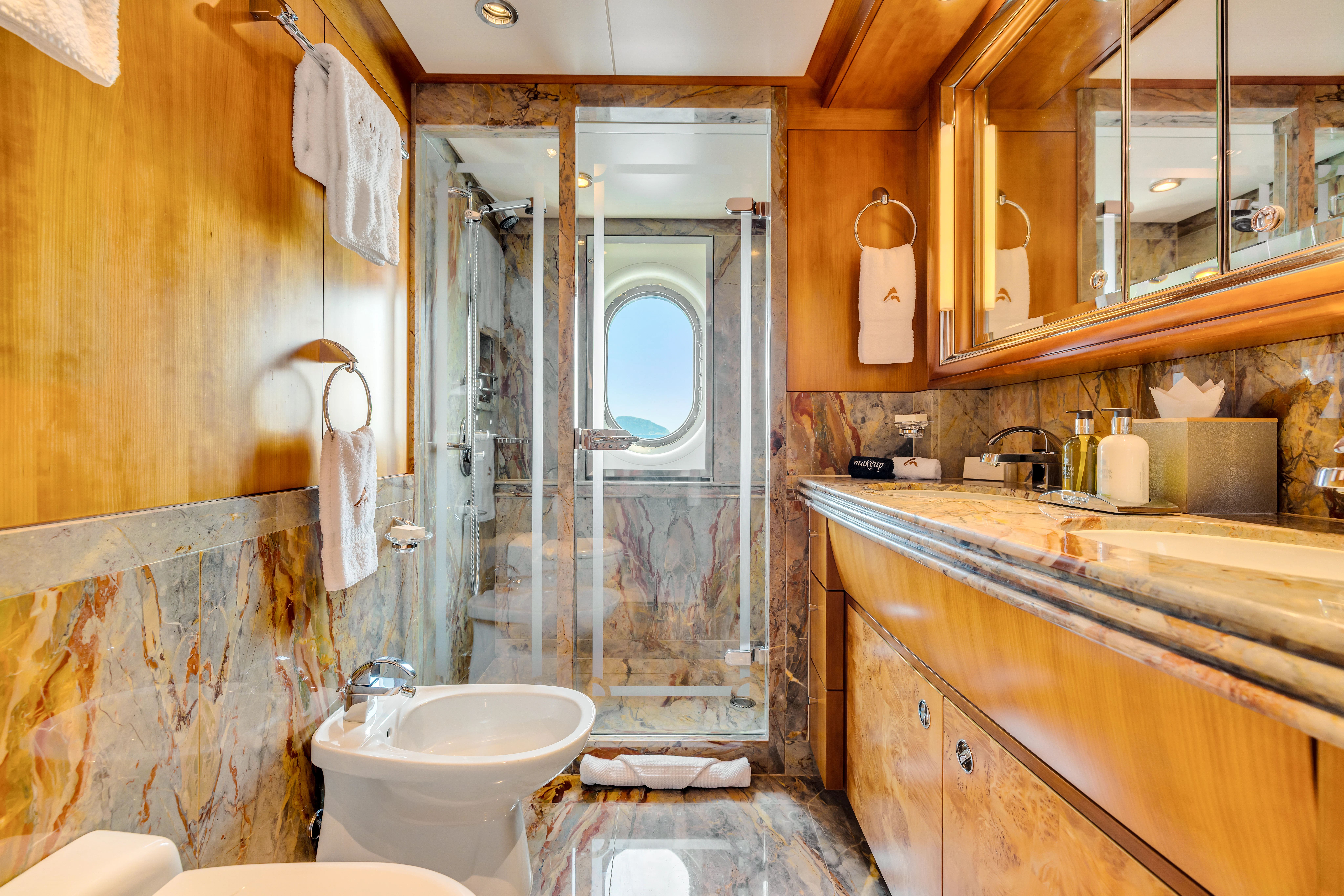 a bathroom with a sink and a toilet aboard AMICA MEA Yacht for Sale