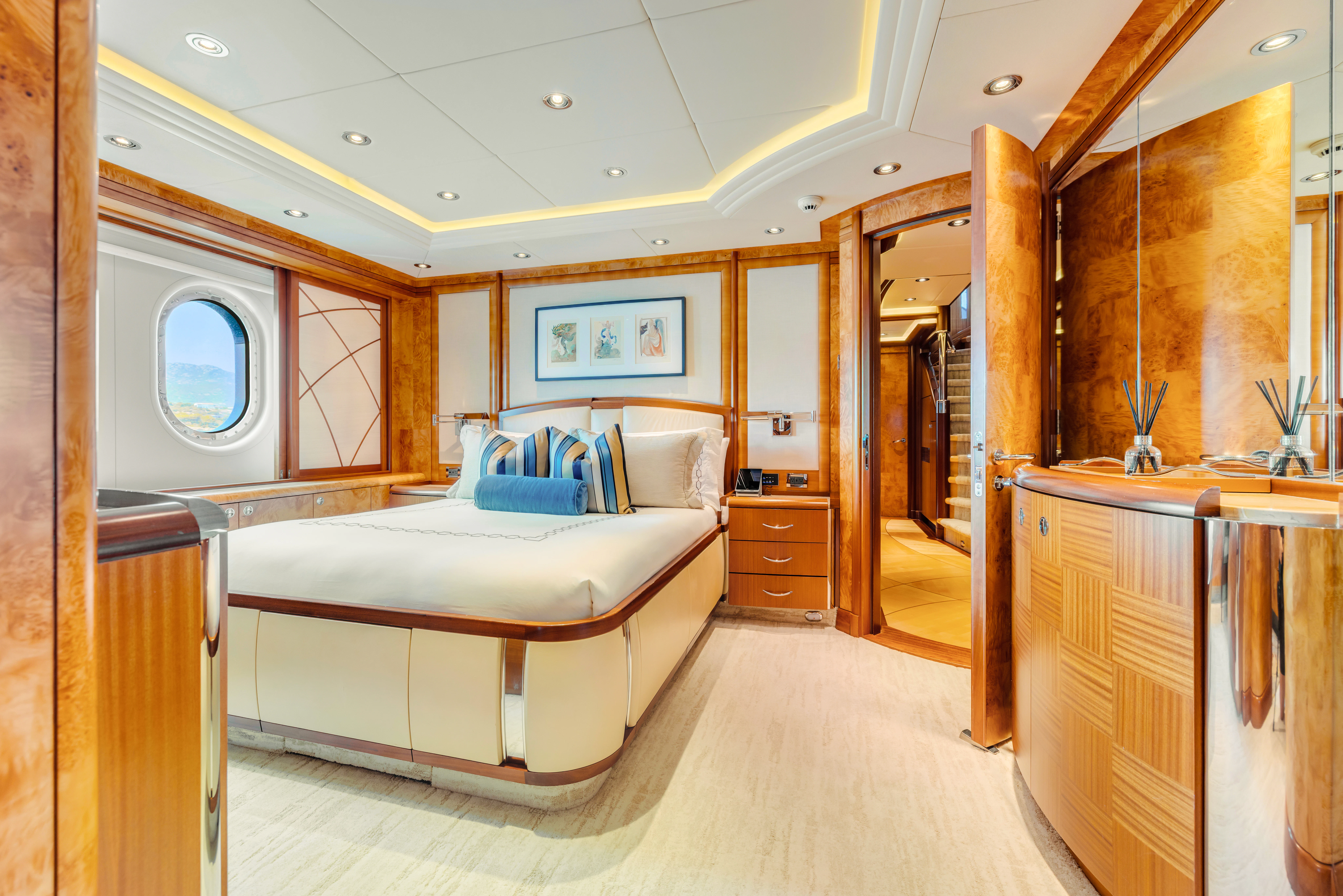 a room with a bed and a mirror aboard AMICA MEA Yacht for Sale