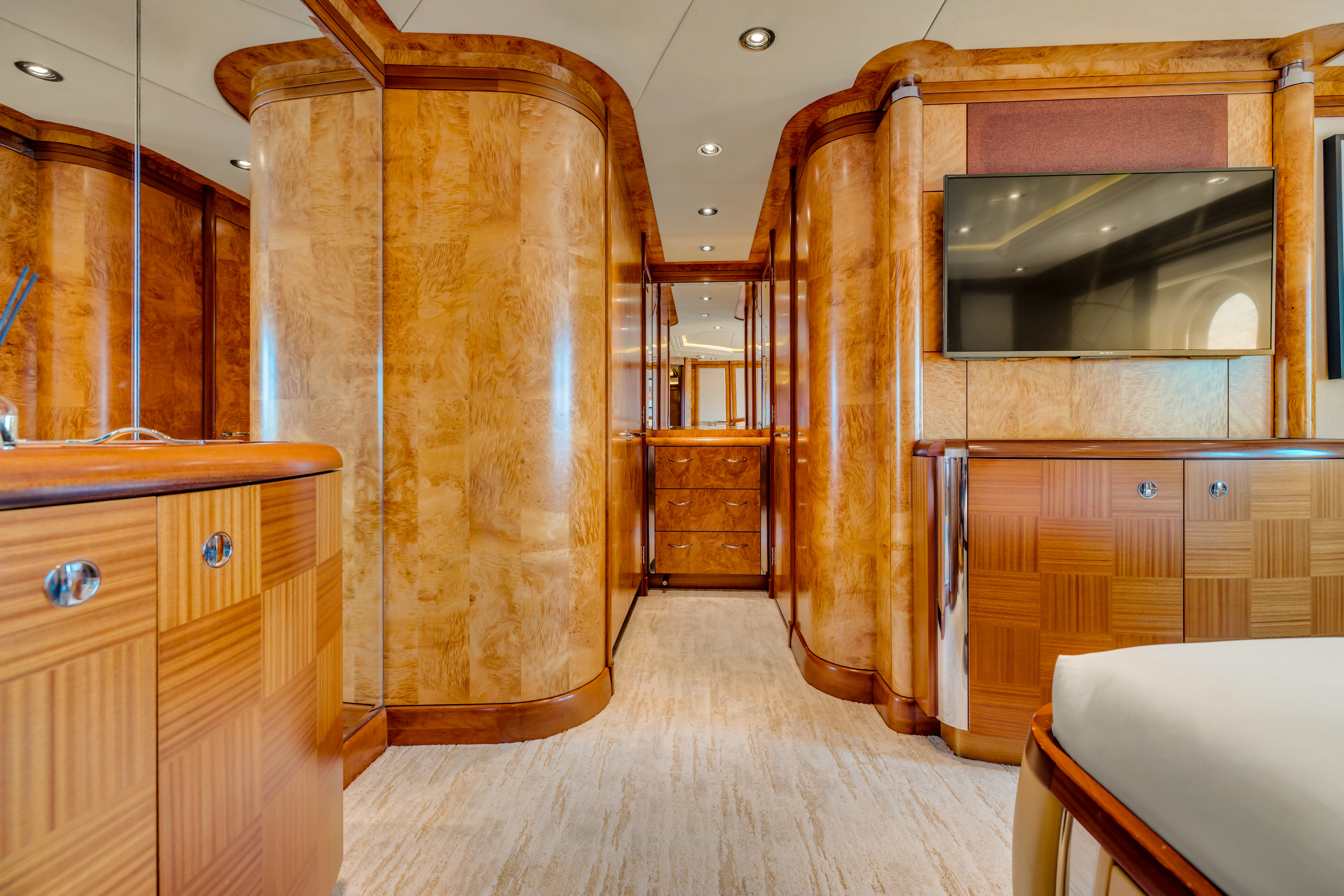 a room with wooden cabinets aboard AMICA MEA Yacht for Sale
