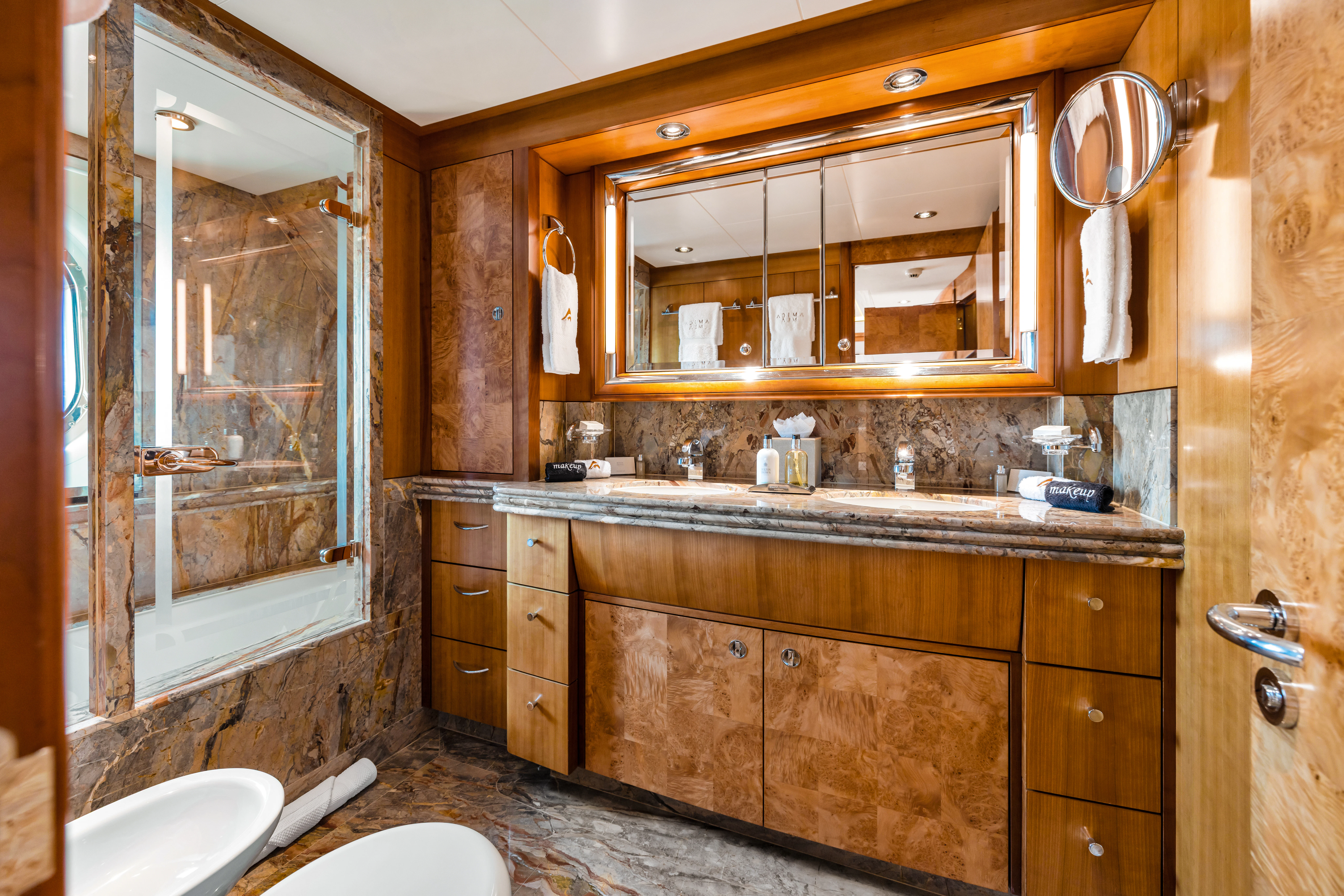 a bathroom with a large mirror aboard AMICA MEA Yacht for Sale
