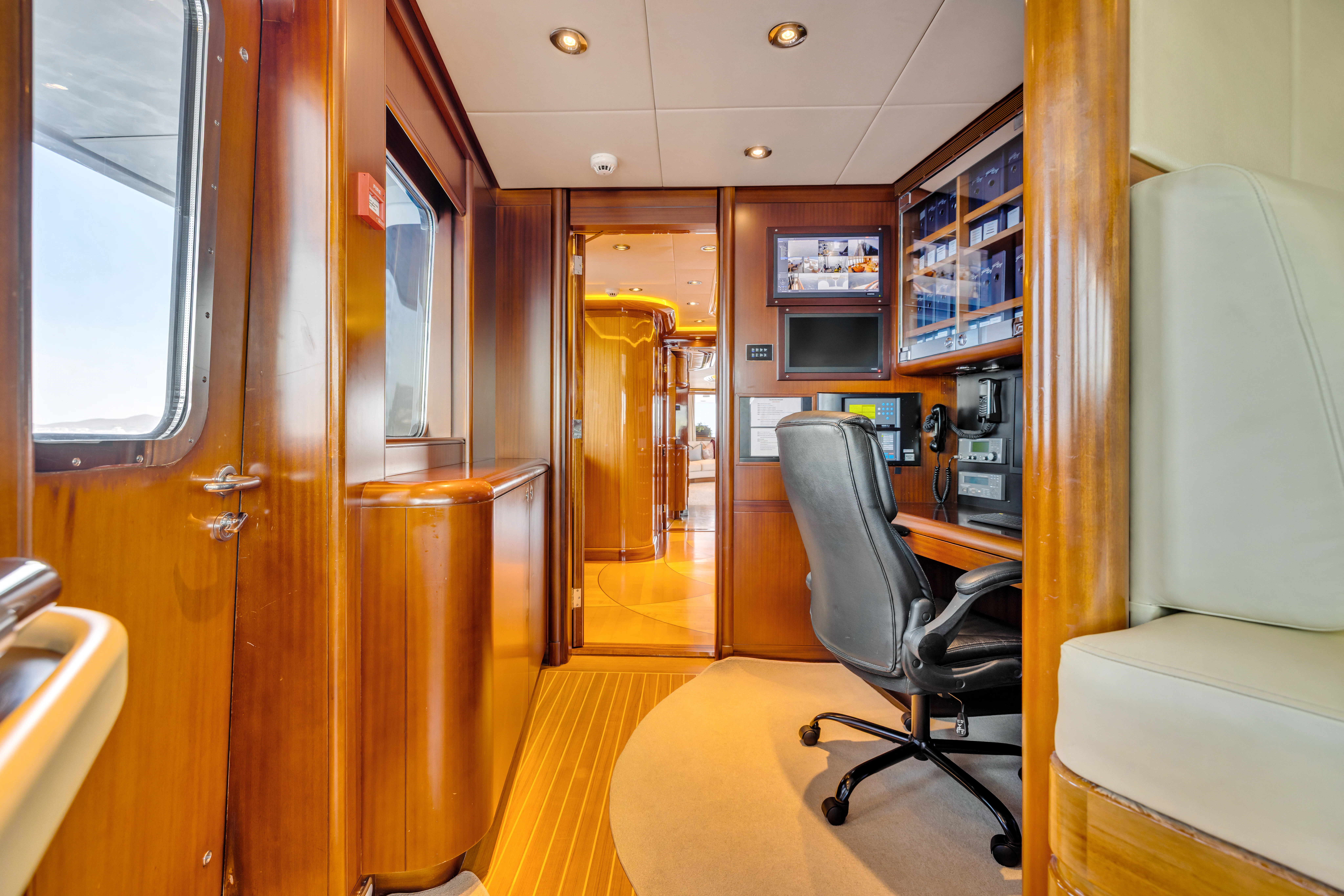 a room with a desk and chairs aboard AMICA MEA Yacht for Sale