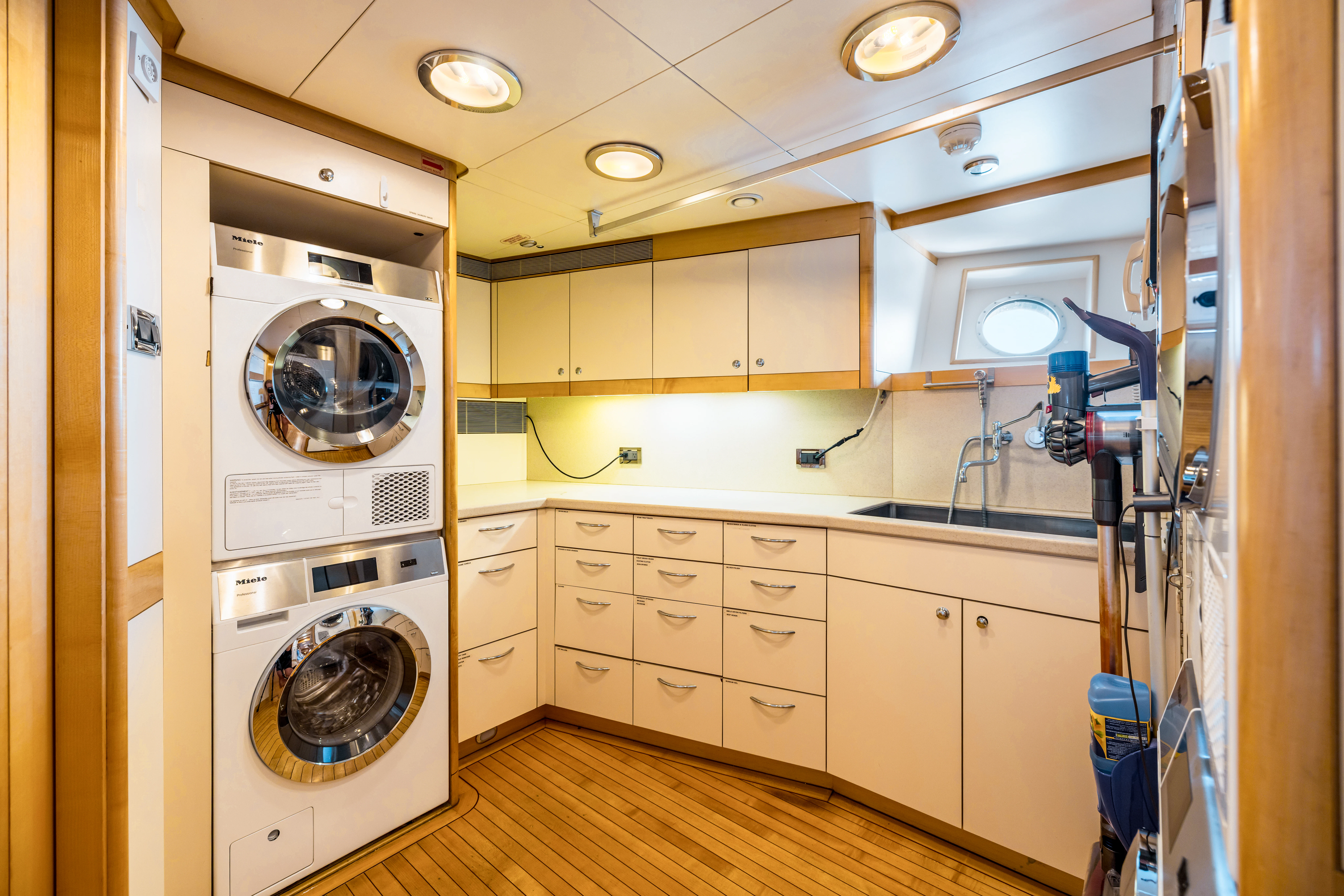 a laundry room with a washing machine aboard AMICA MEA Yacht for Sale