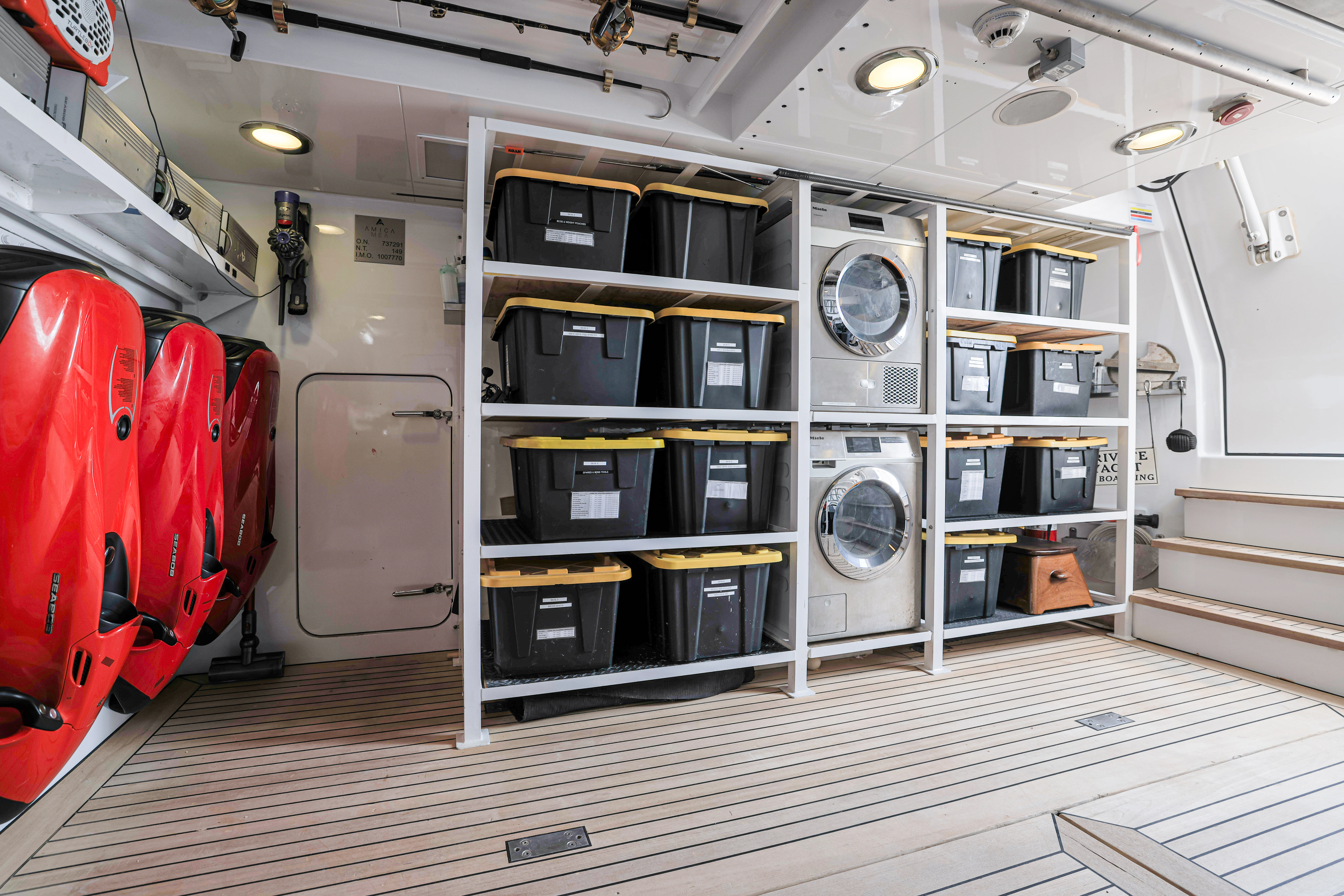 inside of a building with a large machine and a shelf with speakers aboard AMICA MEA Yacht for Sale