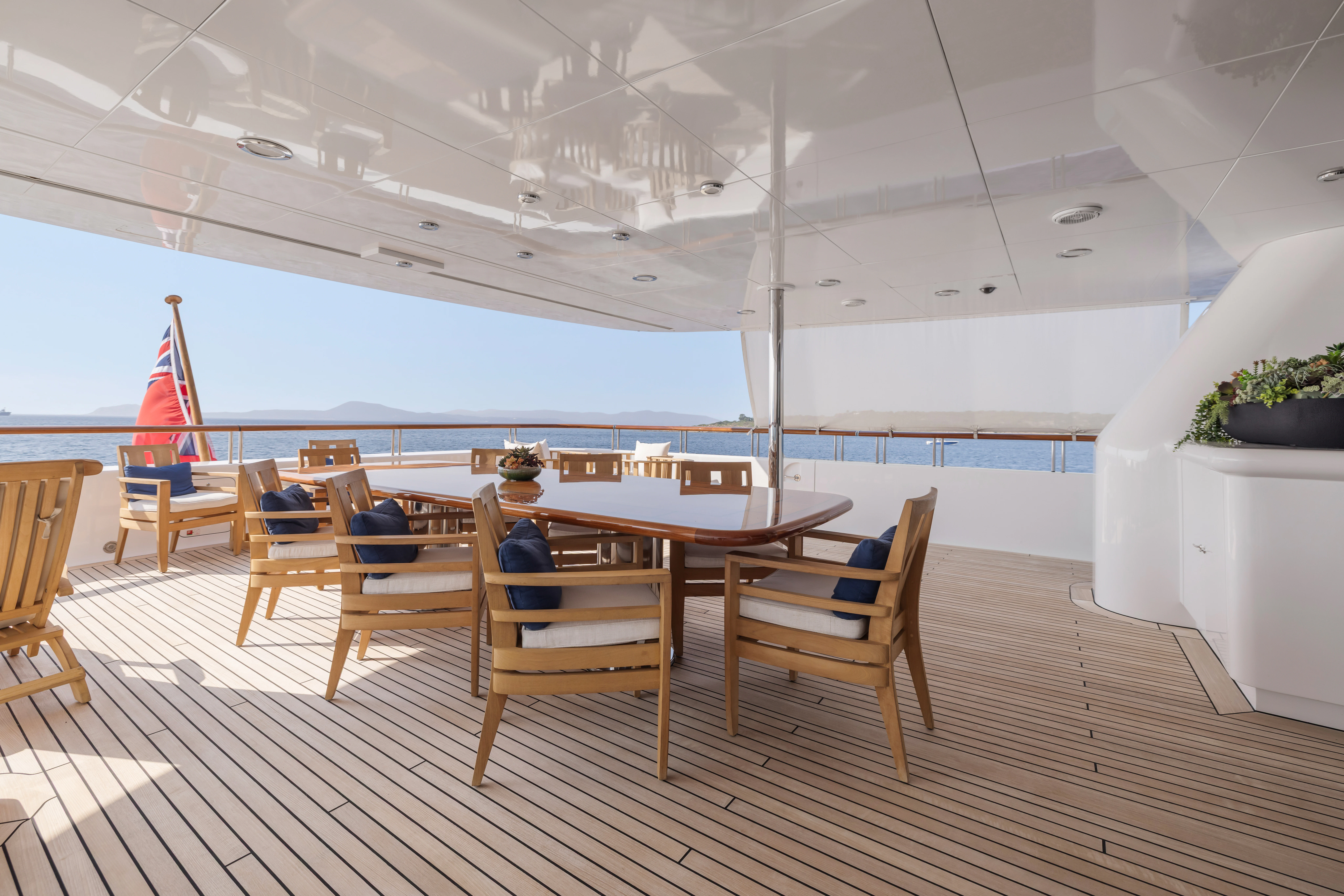 a room with a table and chairs aboard AMICA MEA Yacht for Sale