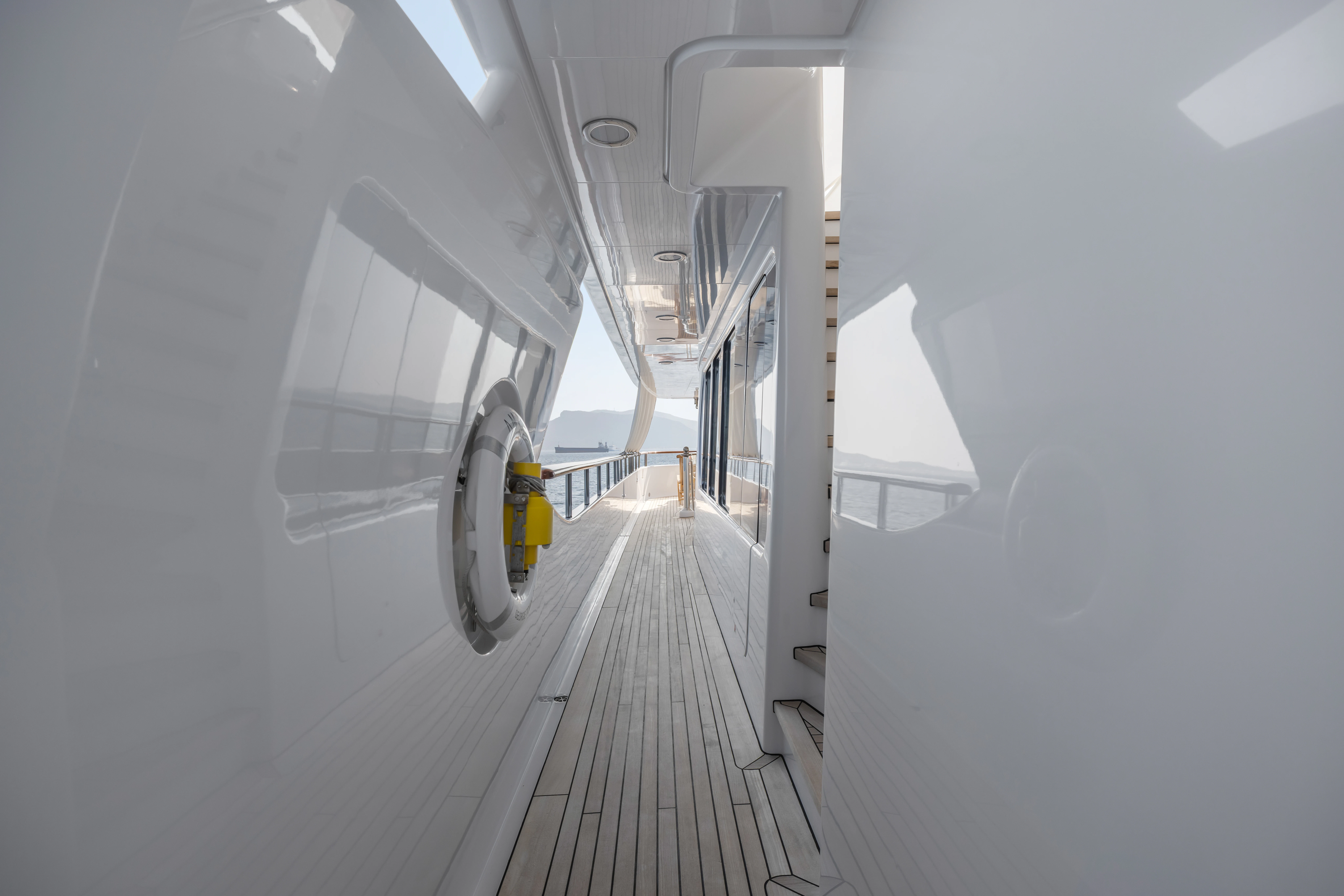 a long hallway with a white wall aboard AMICA MEA Yacht for Sale