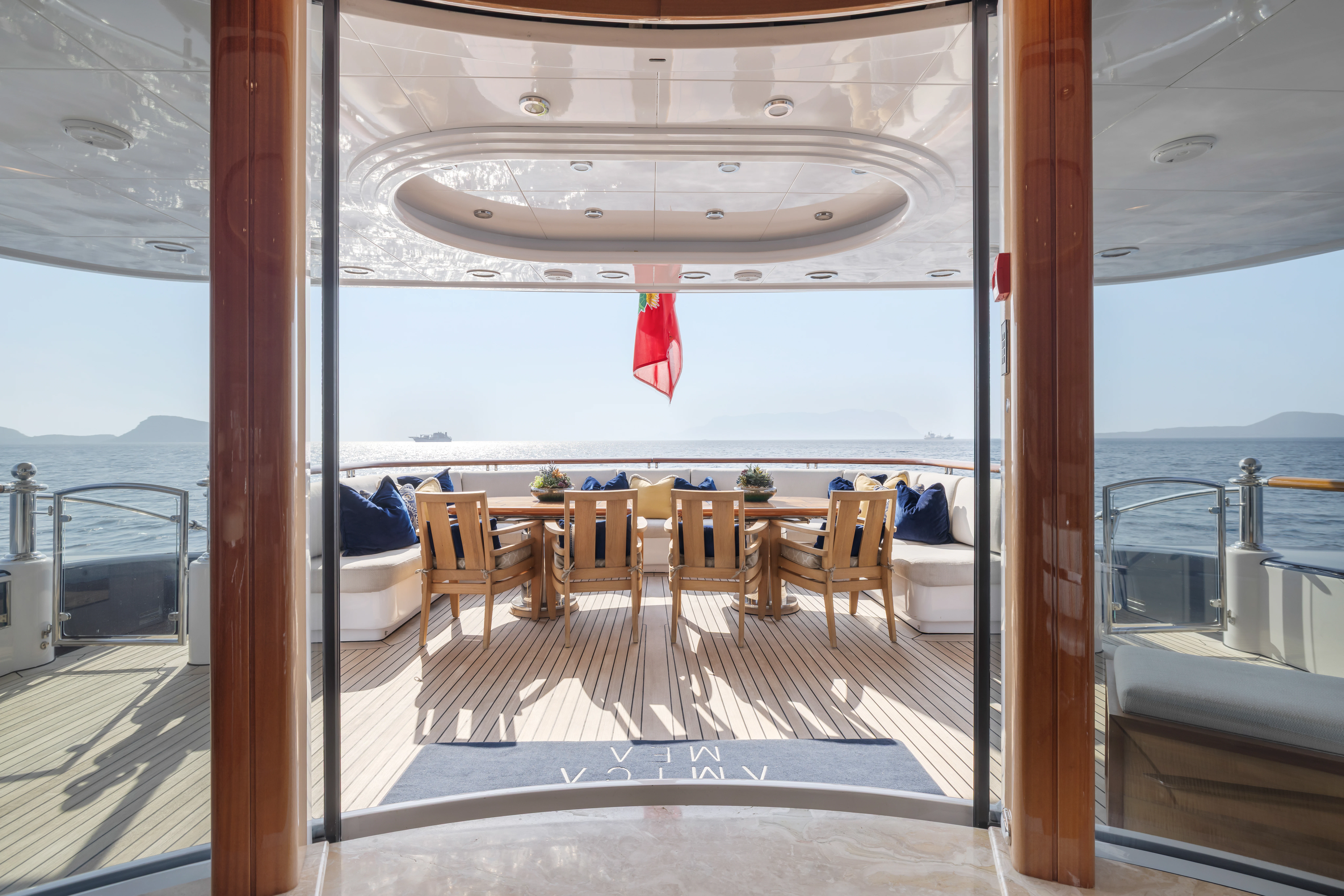 a room with a table and chairs aboard AMICA MEA Yacht for Sale