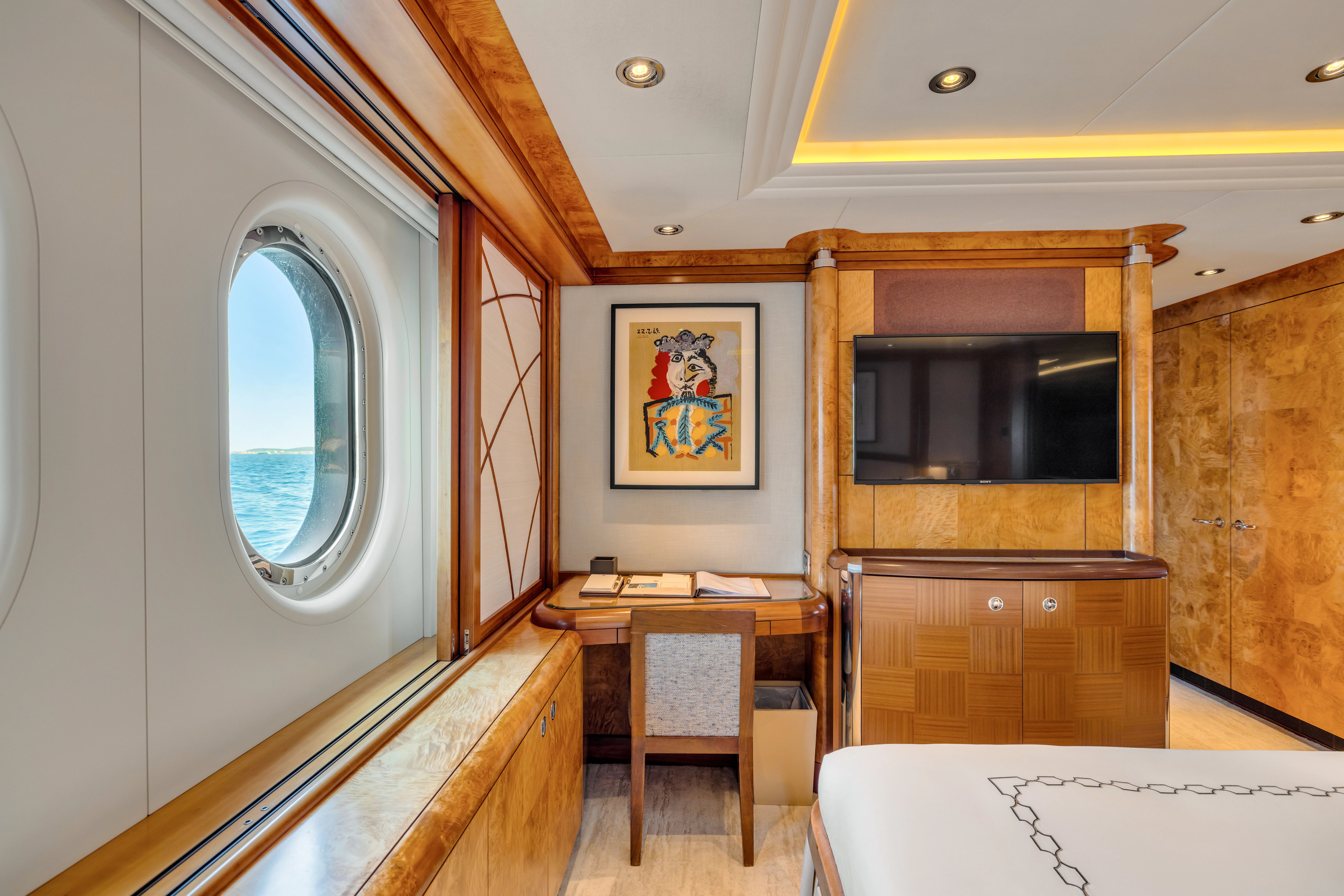 a room with a table and chairs aboard AMICA MEA Yacht for Sale