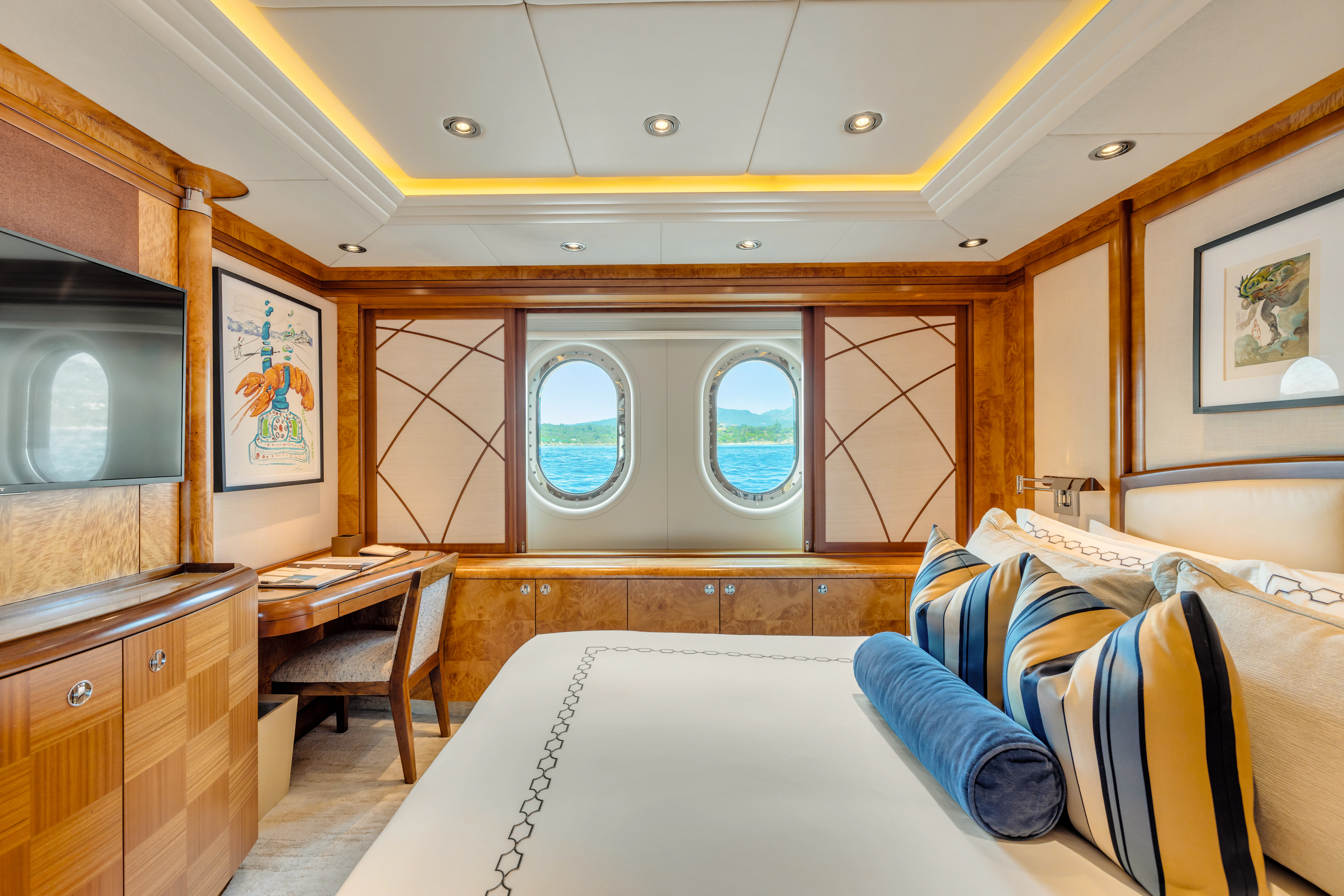a room with a bed and a television aboard AMICA MEA Yacht for Sale