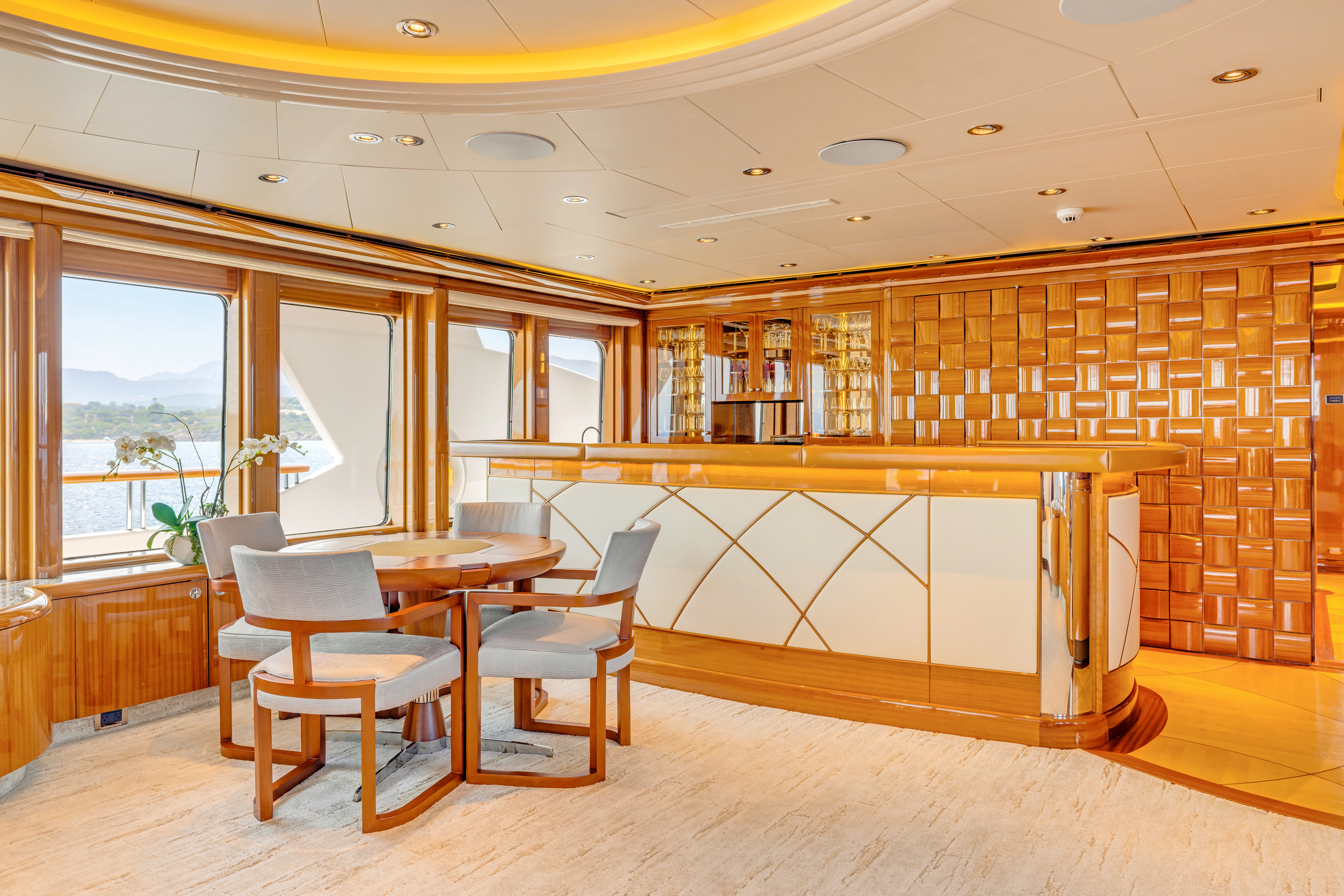a room with a table and chairs aboard AMICA MEA Yacht for Sale