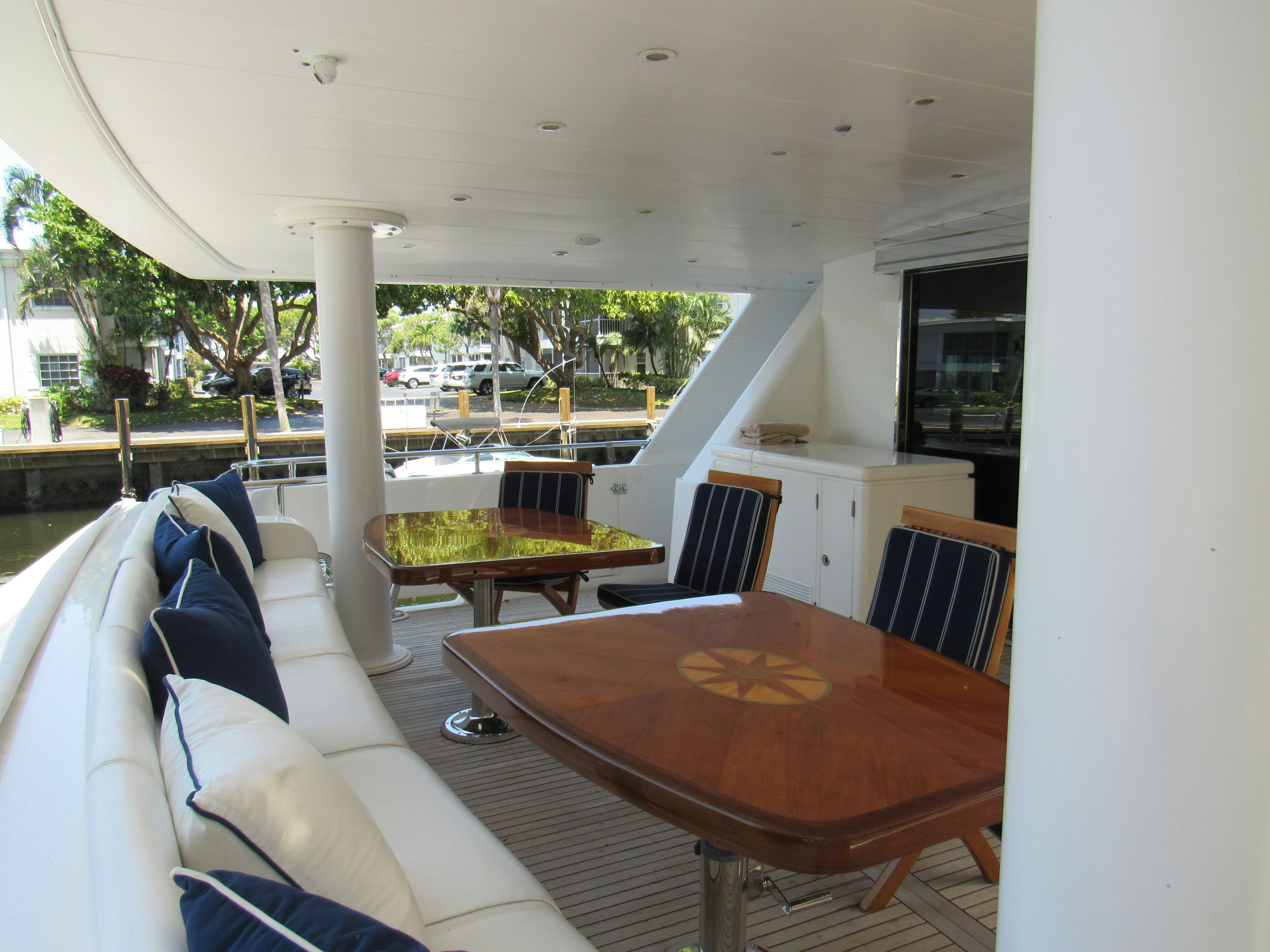 a table and chairs on a balcony aboard SANCTUARY Yacht for Sale