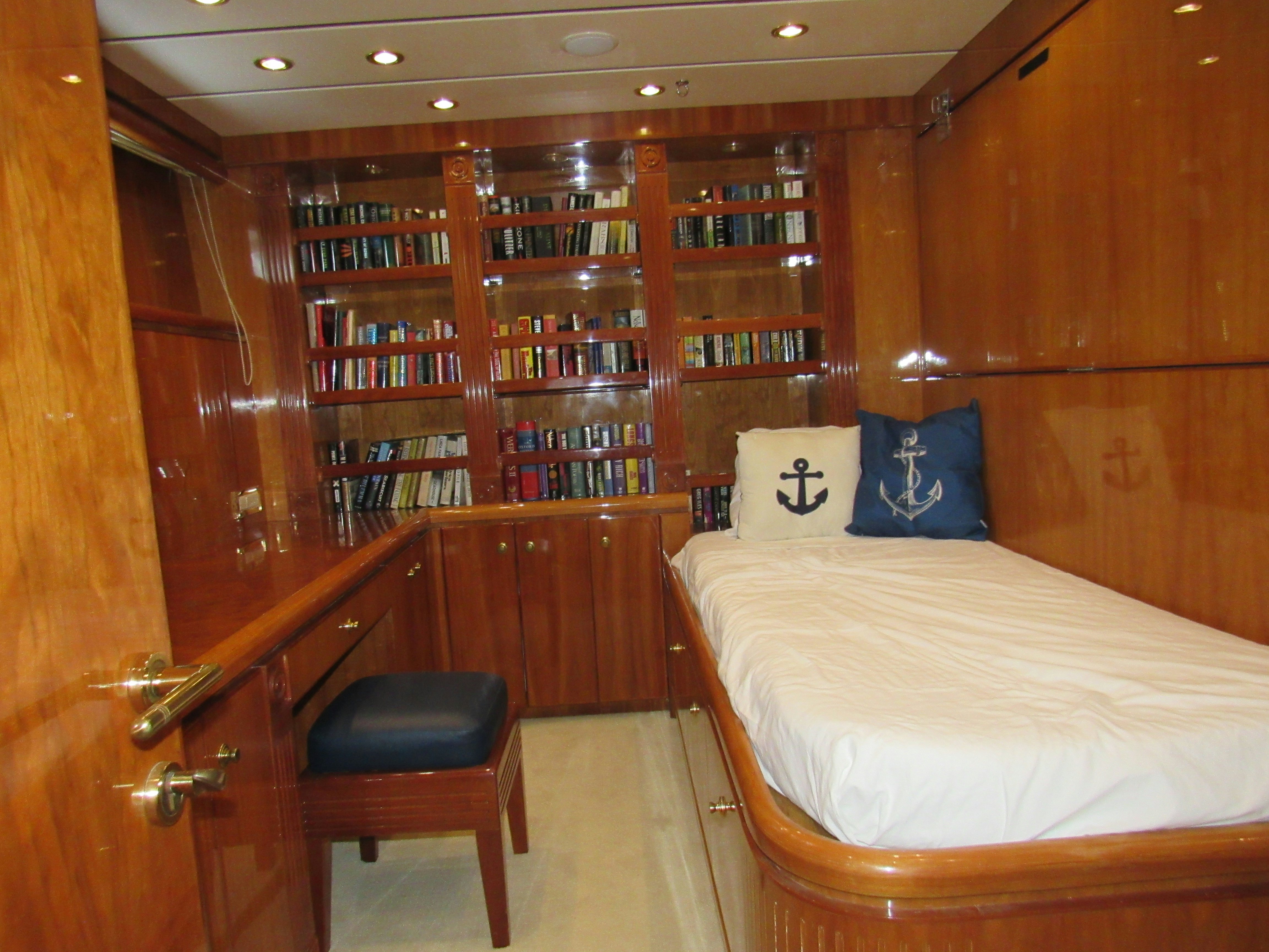 a room with a bed and a chair aboard SANCTUARY Yacht for Sale