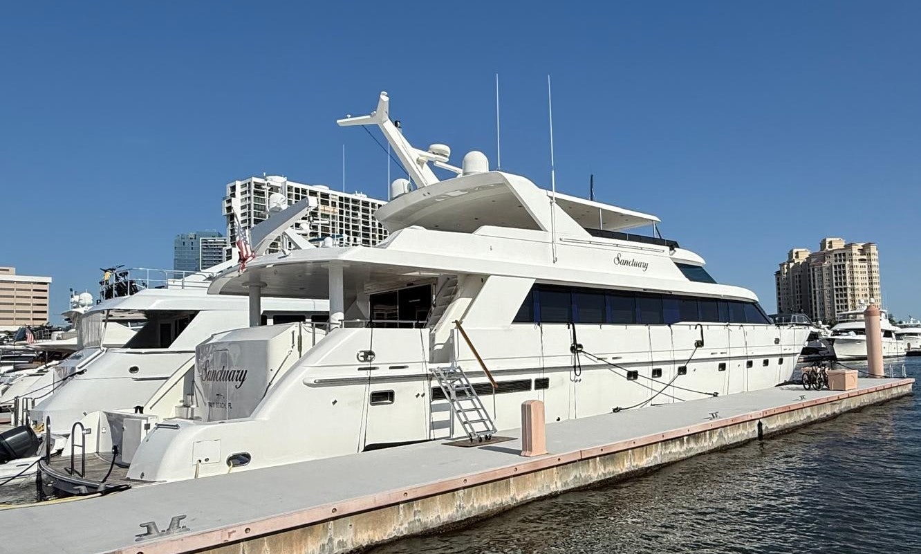 a large white boat with a seagull on it aboard SANCTUARY Yacht for Sale
