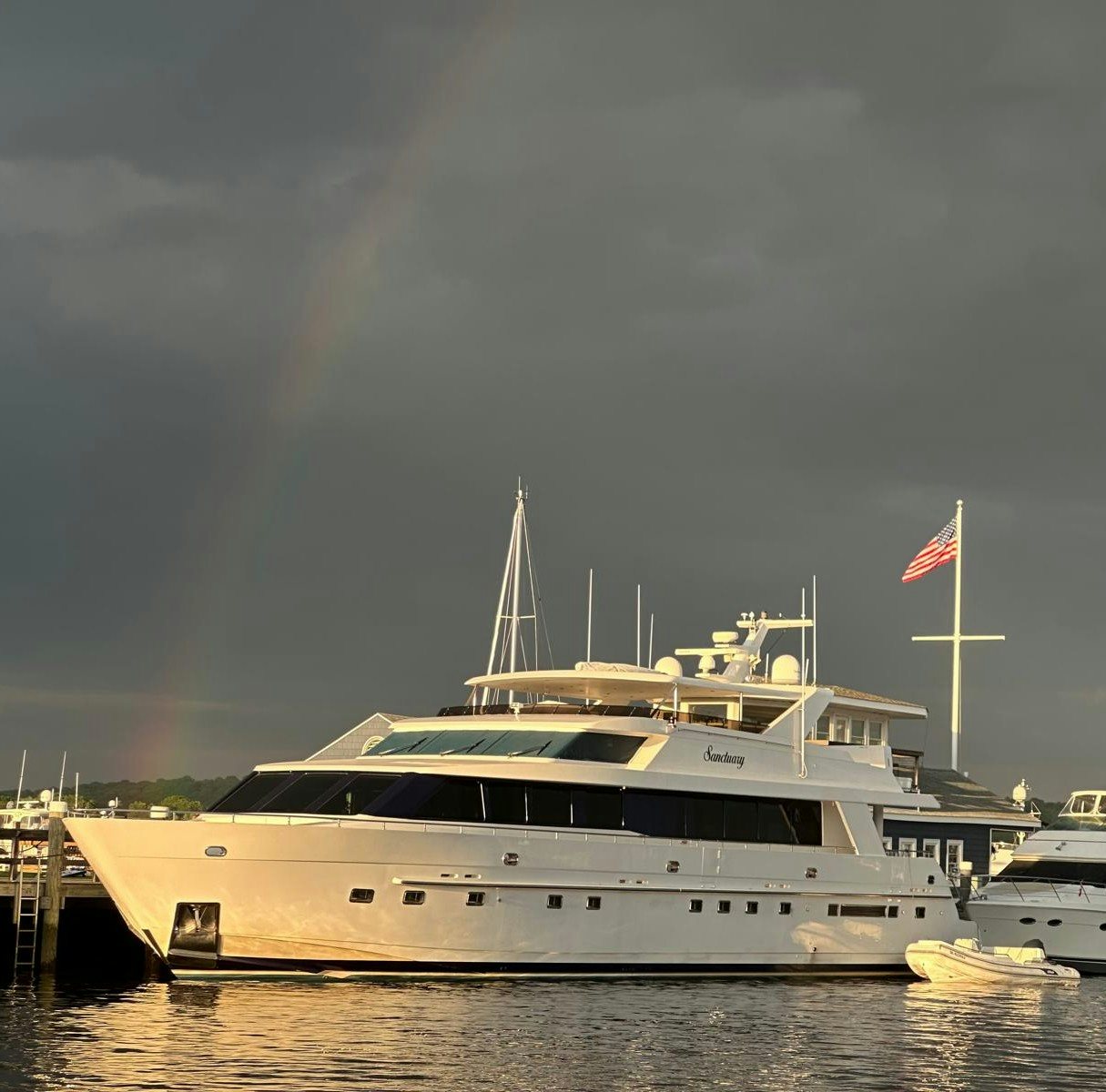 a boat docked at a pier aboard SANCTUARY Yacht for Sale