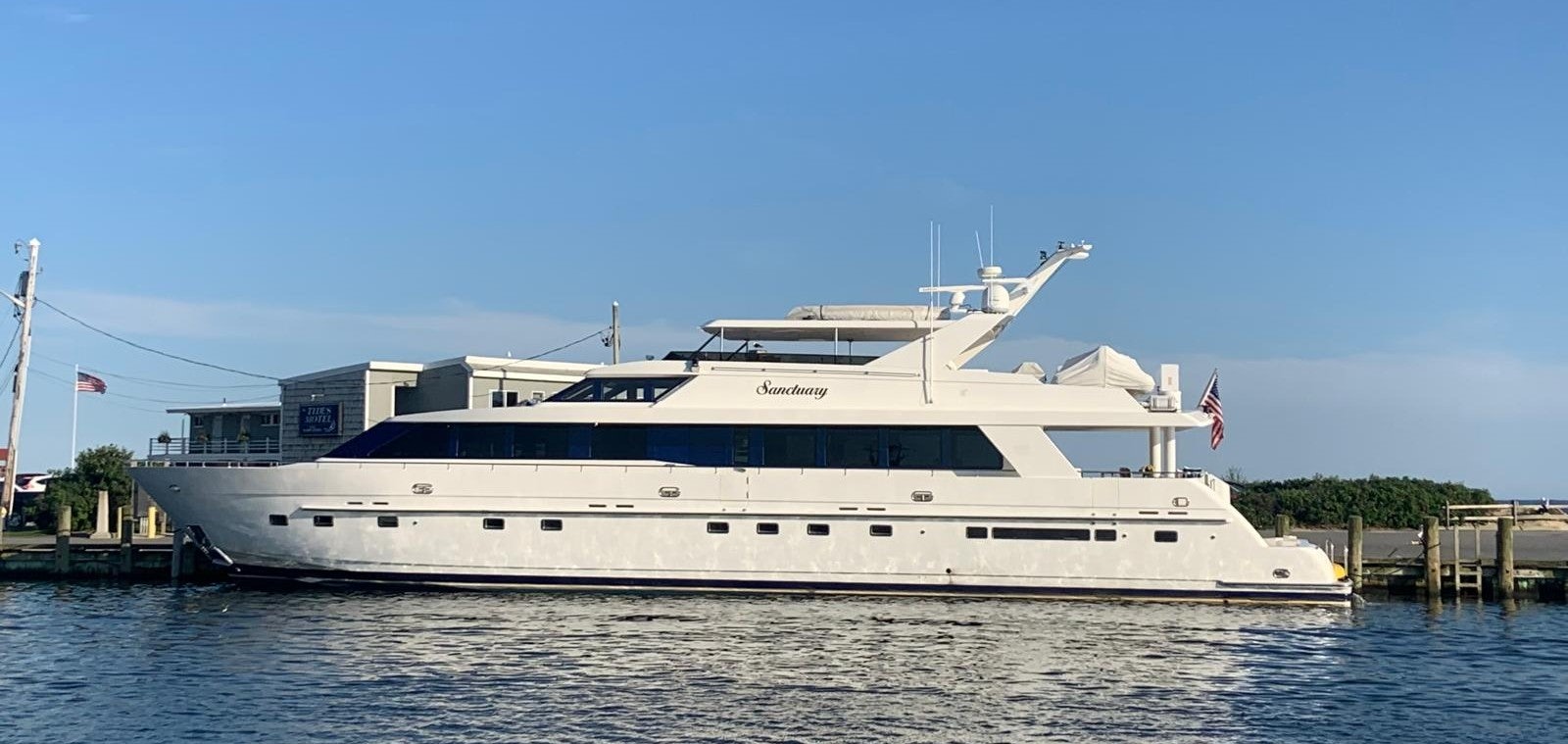 a large white yacht aboard SANCTUARY Yacht for Sale