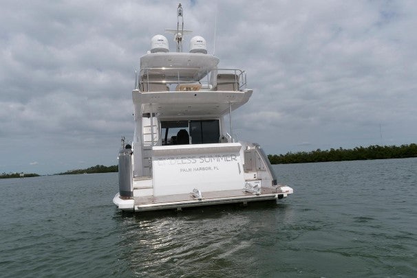 a white boat on the water aboard ENDLESS SUMMER Yacht for Sale