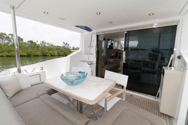 a room with a table and chairs aboard ENDLESS SUMMER Yacht for Sale