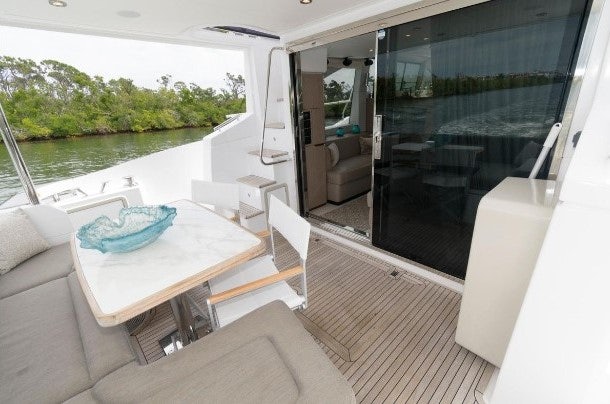 a room with a table and chairs aboard ENDLESS SUMMER Yacht for Sale