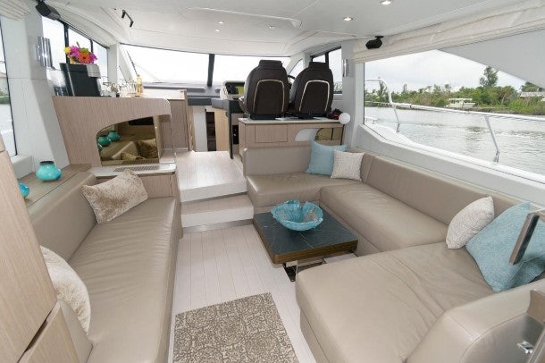 a living room with a couch and a table aboard ENDLESS SUMMER Yacht for Sale