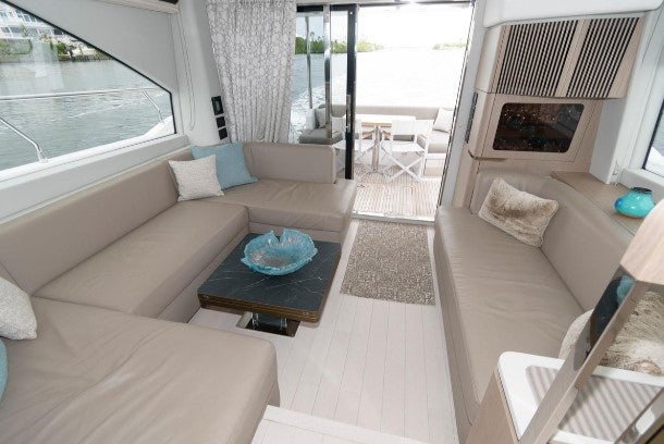 a living room with a couch and a table aboard ENDLESS SUMMER Yacht for Sale
