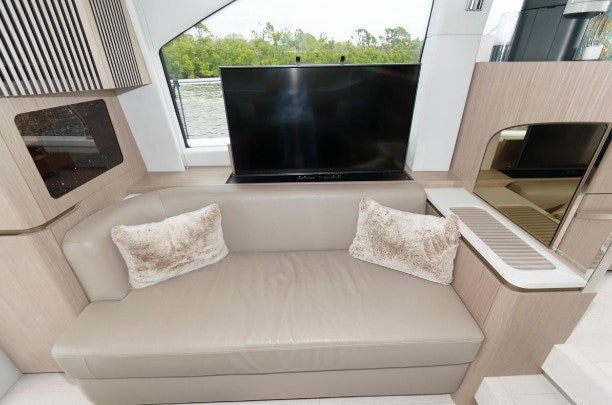 a couch with pillows on it aboard ENDLESS SUMMER Yacht for Sale