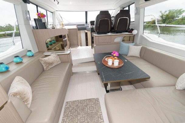 a living room with a couch and a coffee table aboard ENDLESS SUMMER Yacht for Sale