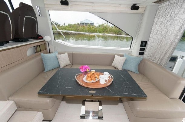 a couch with a coffee table aboard ENDLESS SUMMER Yacht for Sale