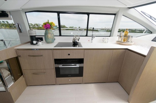 a kitchen with a sink and a window aboard ENDLESS SUMMER Yacht for Sale