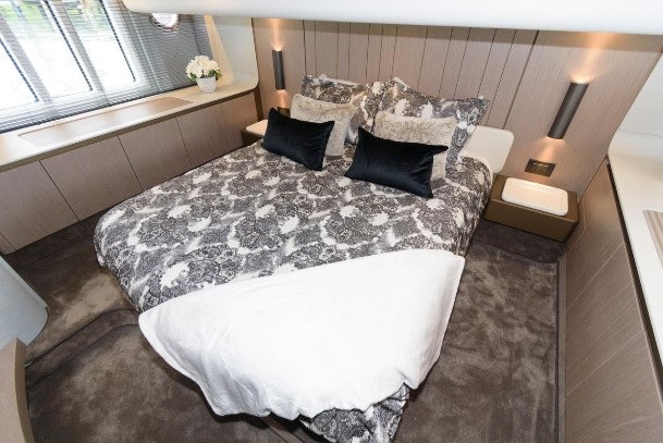 a bed with white sheets aboard ENDLESS SUMMER Yacht for Sale