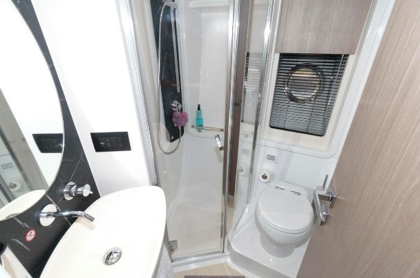 a bathroom with a toilet and sink aboard ENDLESS SUMMER Yacht for Sale