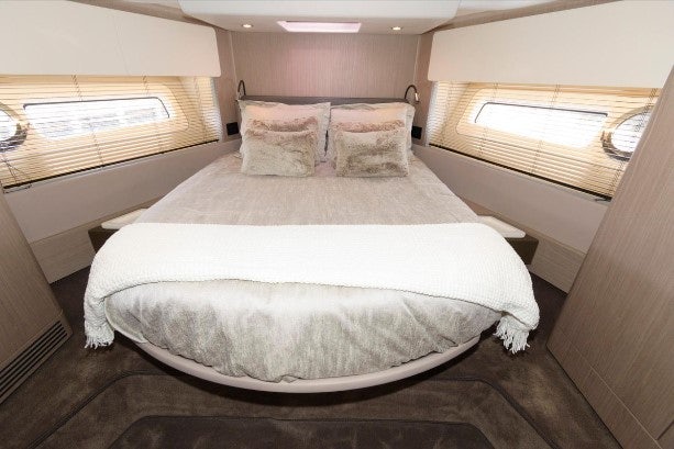 a bed with white sheets aboard ENDLESS SUMMER Yacht for Sale