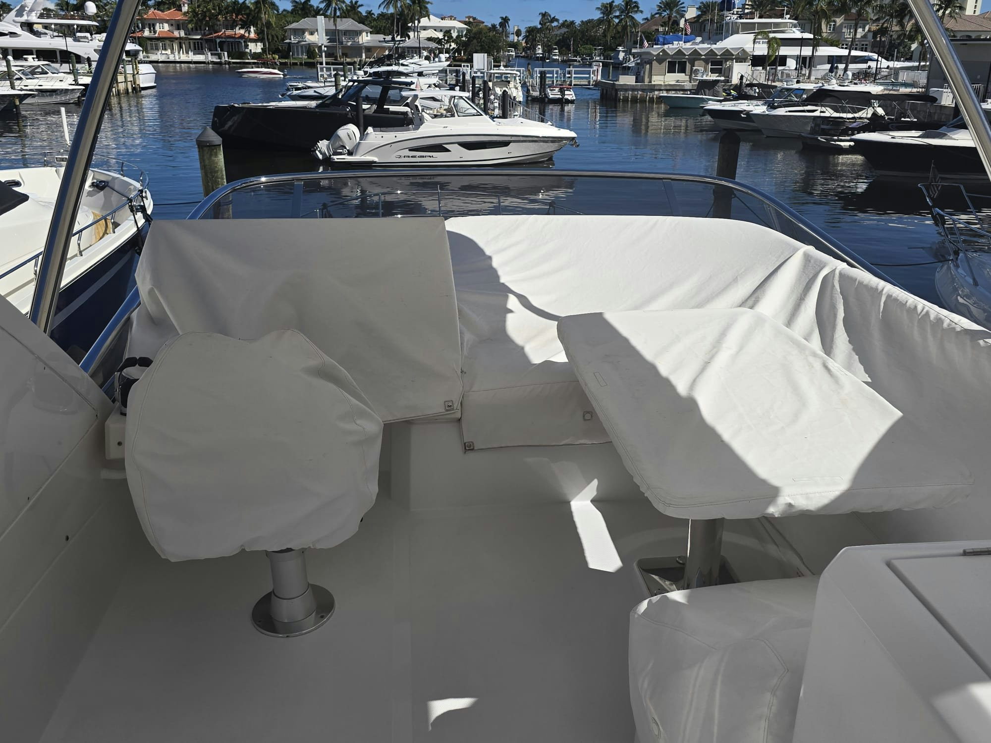 a white couch on a boat dock aboard ENDLESS SUMMER Yacht for Sale