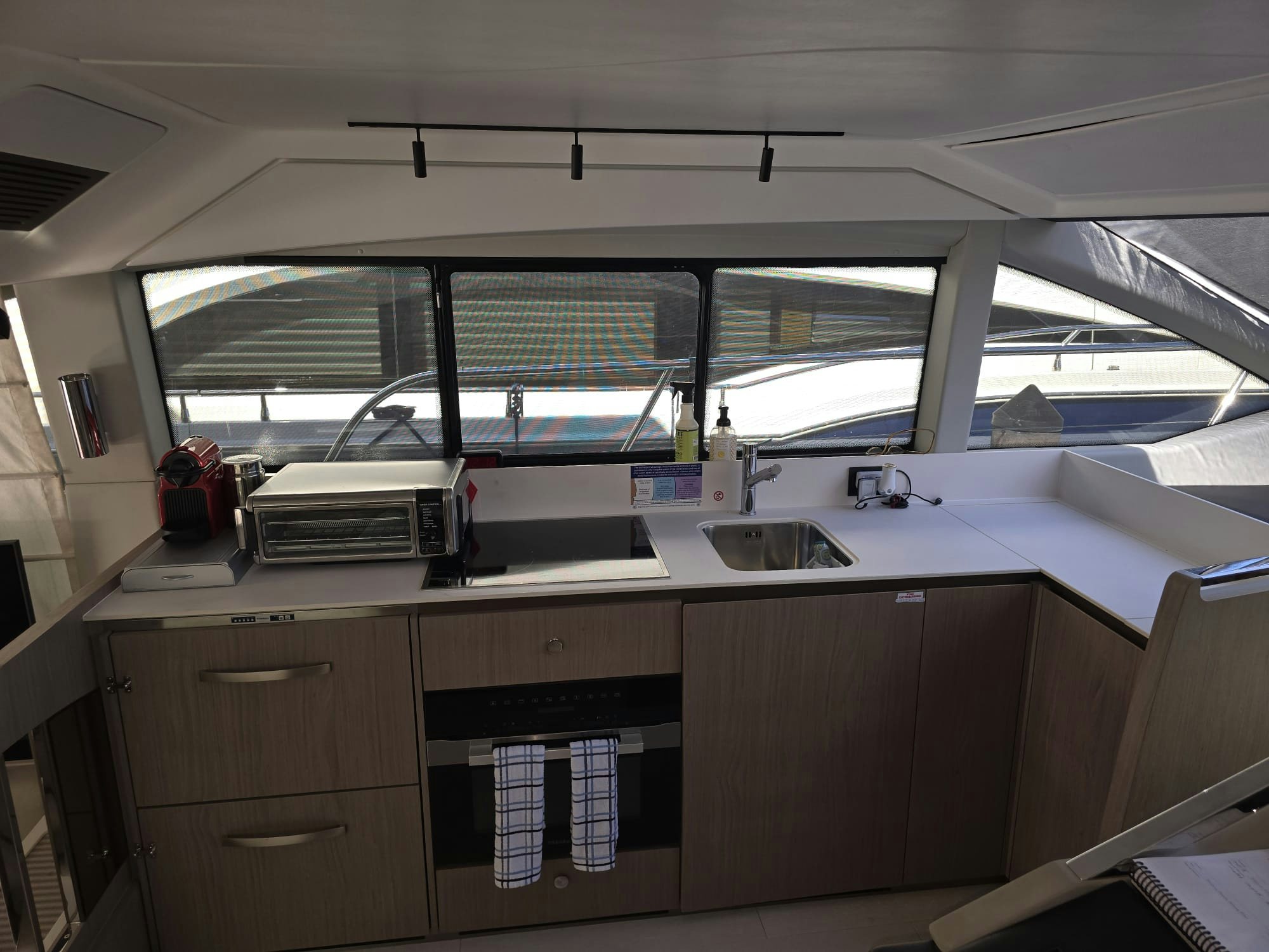 a kitchen with a sink and a window aboard ENDLESS SUMMER Yacht for Sale