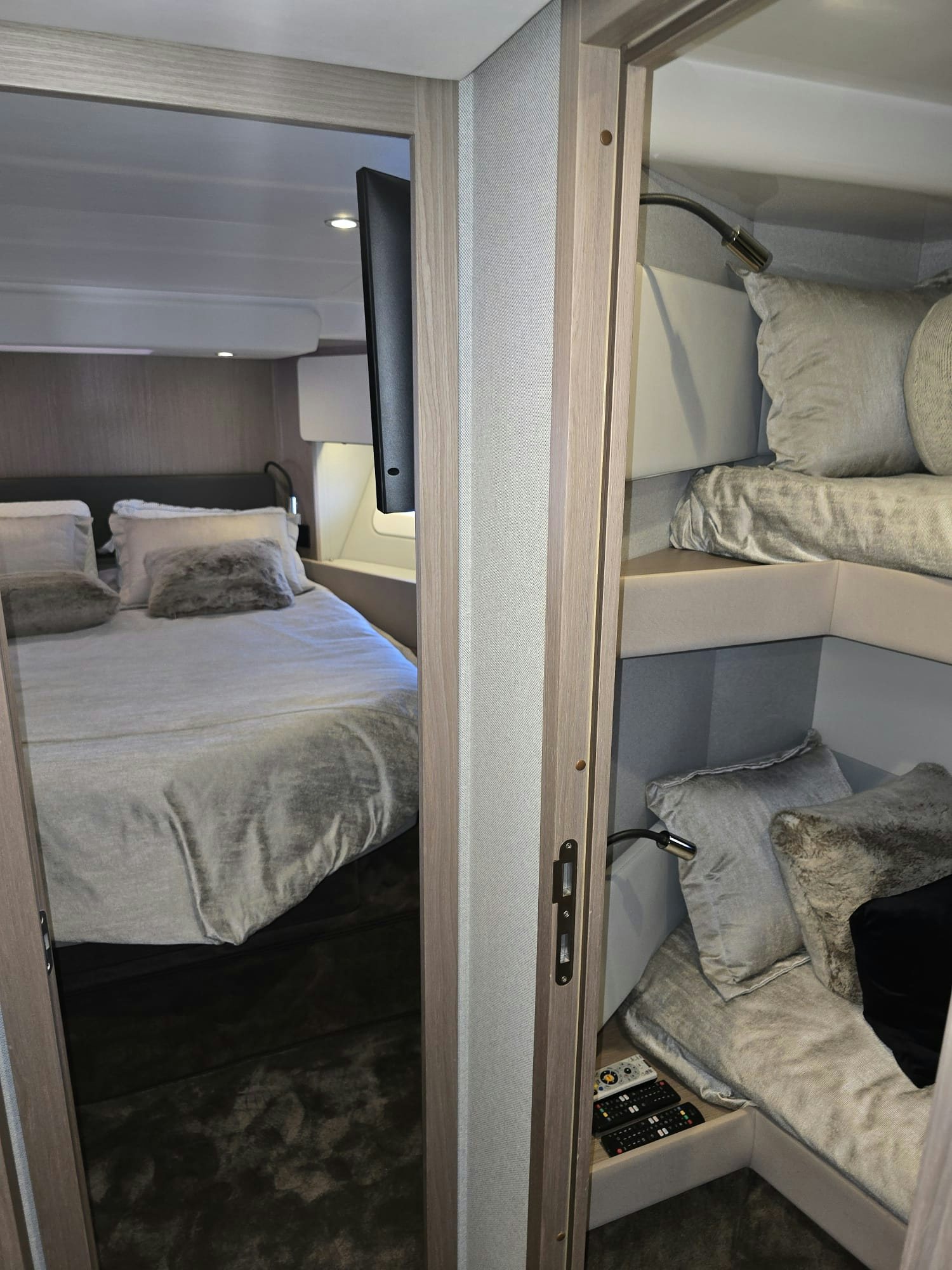 a bedroom with a bed and a desk aboard ENDLESS SUMMER Yacht for Sale