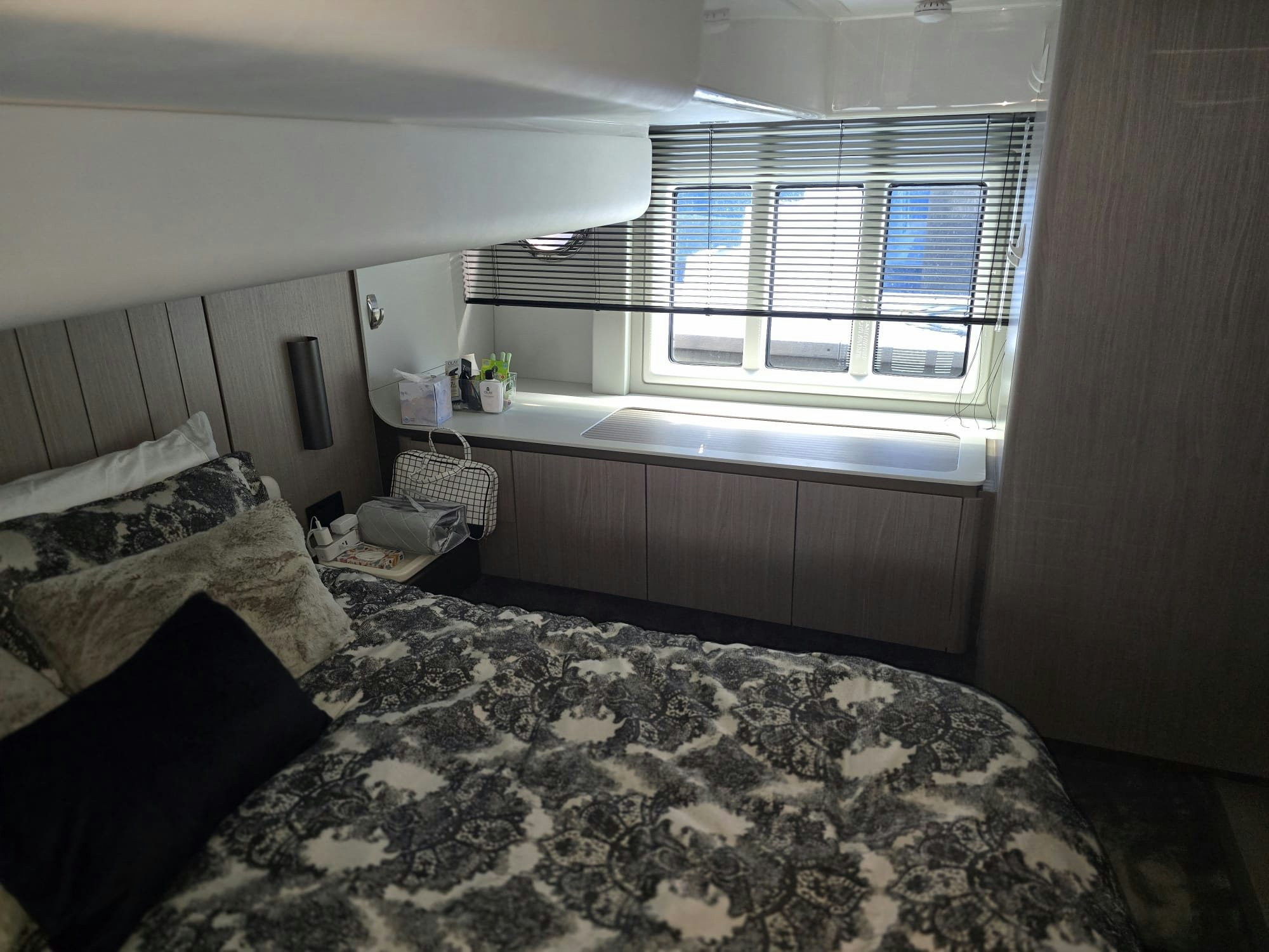 a bedroom with a bed and a chair aboard ENDLESS SUMMER Yacht for Sale