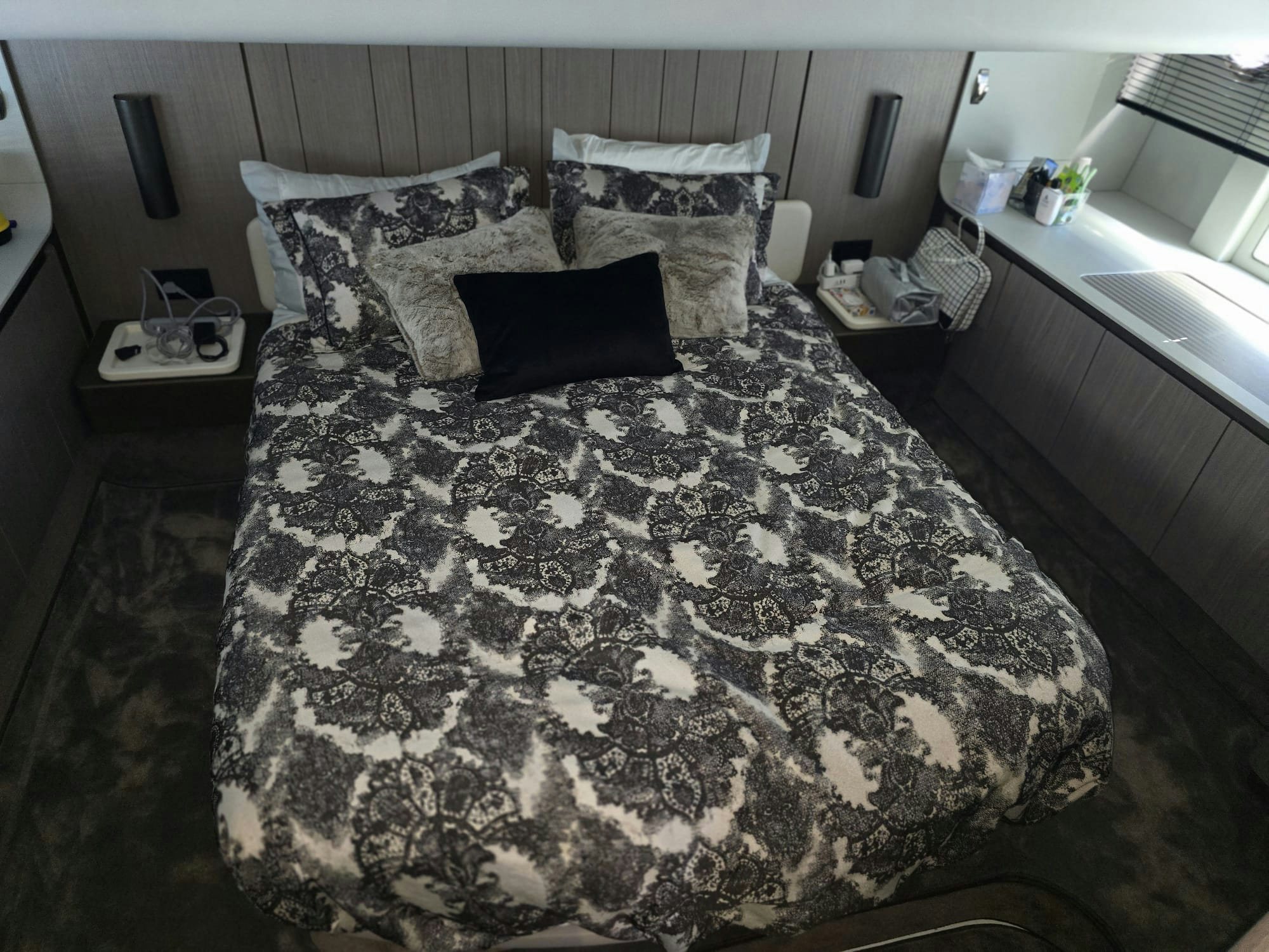 a bed with black and white sheets aboard ENDLESS SUMMER Yacht for Sale