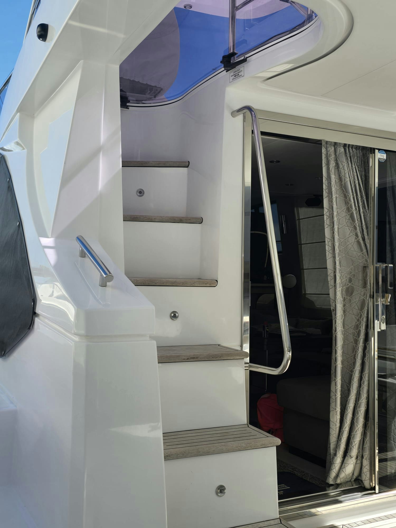 a white staircase with a blue umbrella aboard ENDLESS SUMMER Yacht for Sale