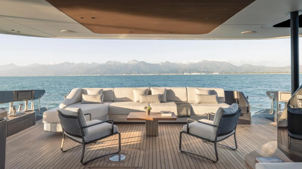 a living room with a large body of water aboard ILMA Yacht for Charter