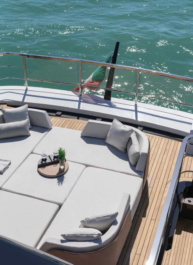 a boat with a chair and a table on it aboard ILMA Yacht for Charter