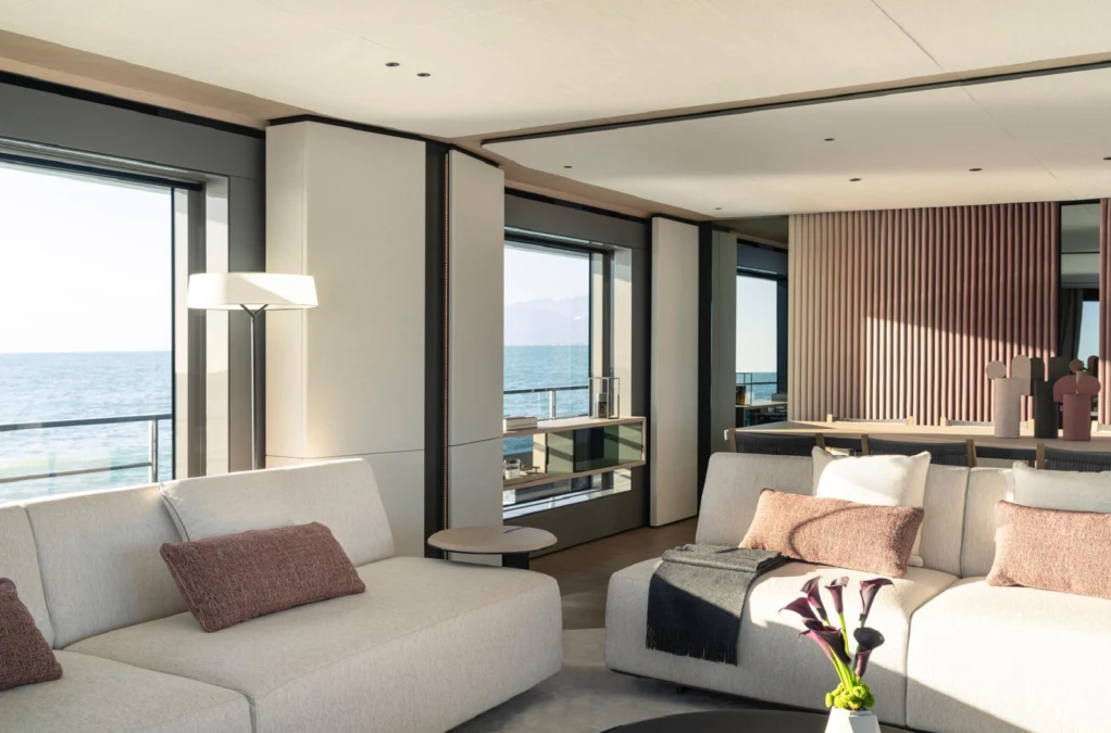 a living room with a large window aboard ILMA Yacht for Charter