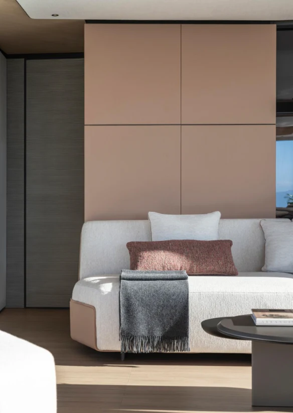 a white couch with a coffee table aboard ILMA Yacht for Charter